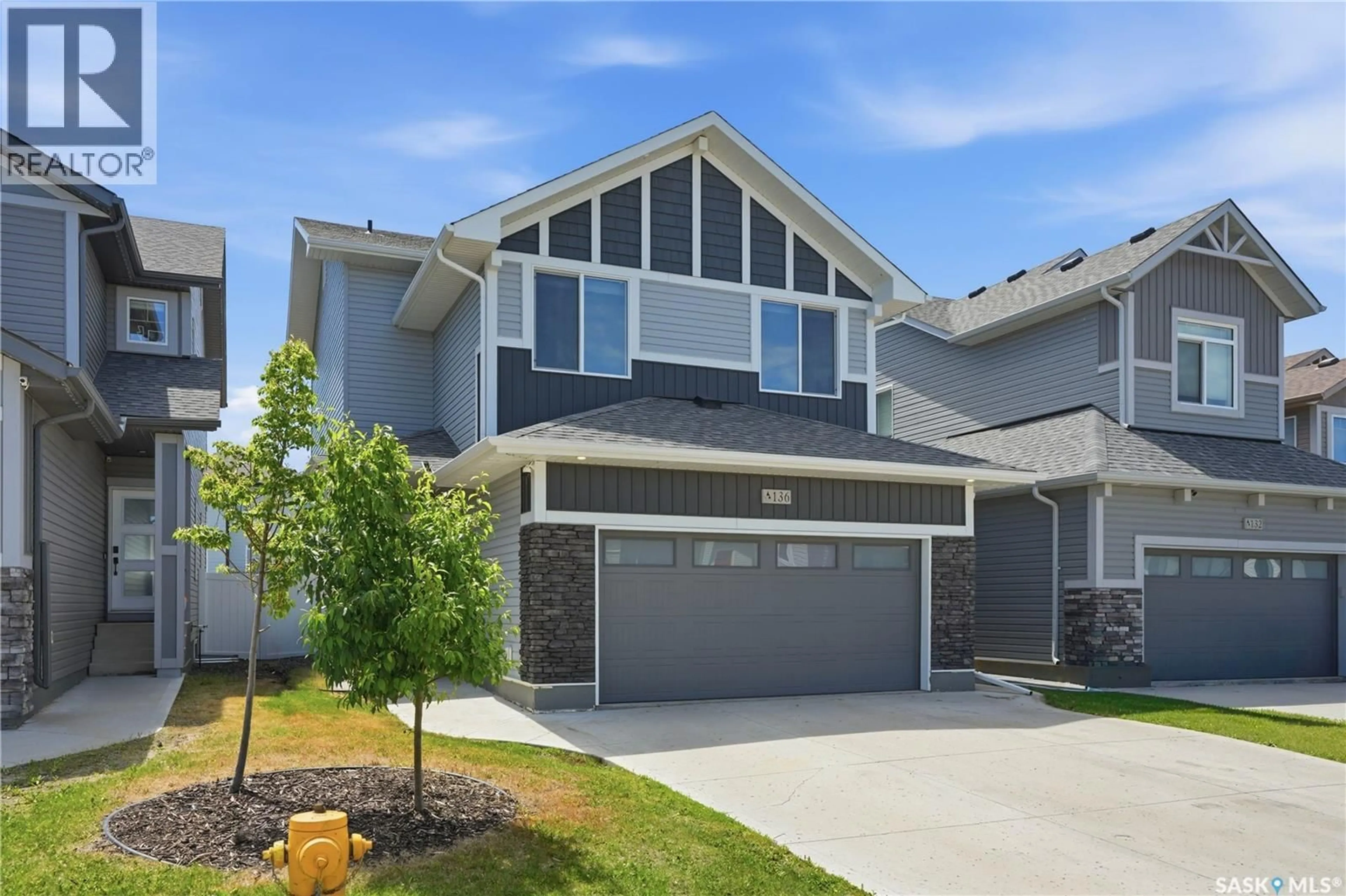 Home with vinyl exterior material, street for 136 THAKUR STREET, Saskatoon Saskatchewan S7W0Z6