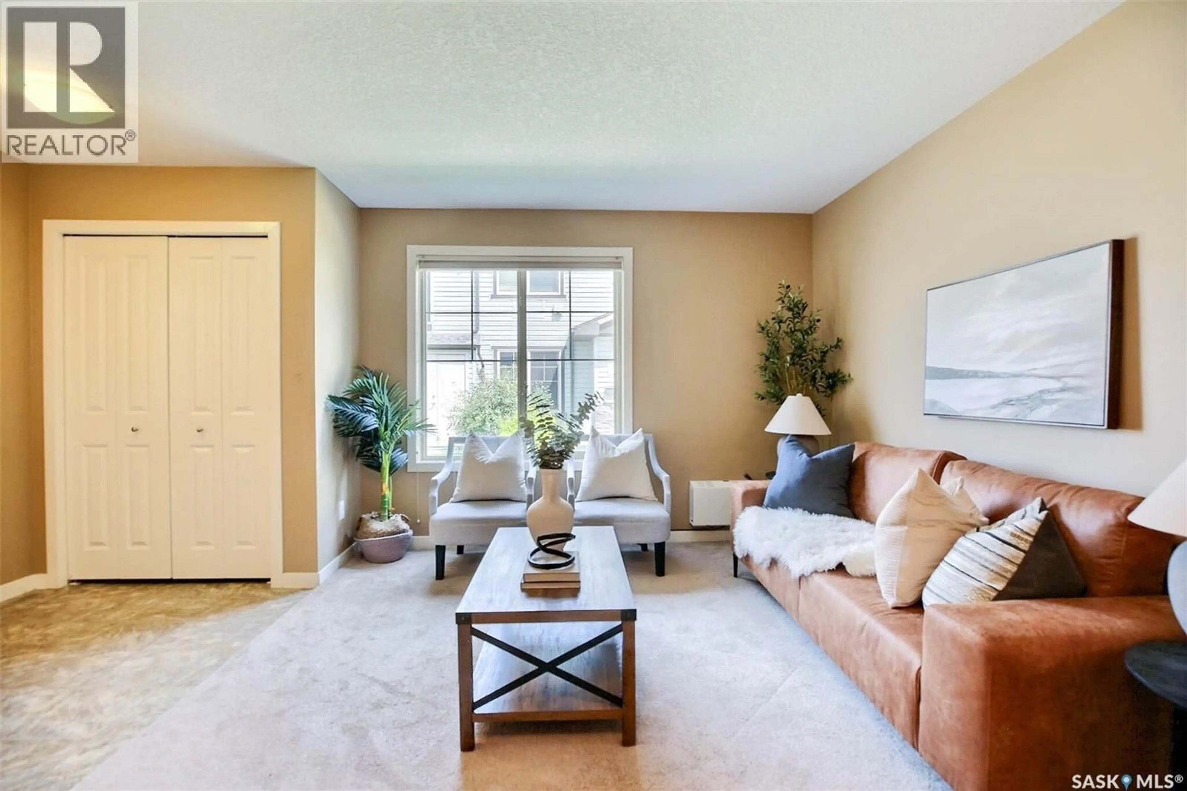 Living room with furniture, carpet floor for 5011 - 10 JAMES HILL ROAD, Regina Saskatchewan S4W0B9