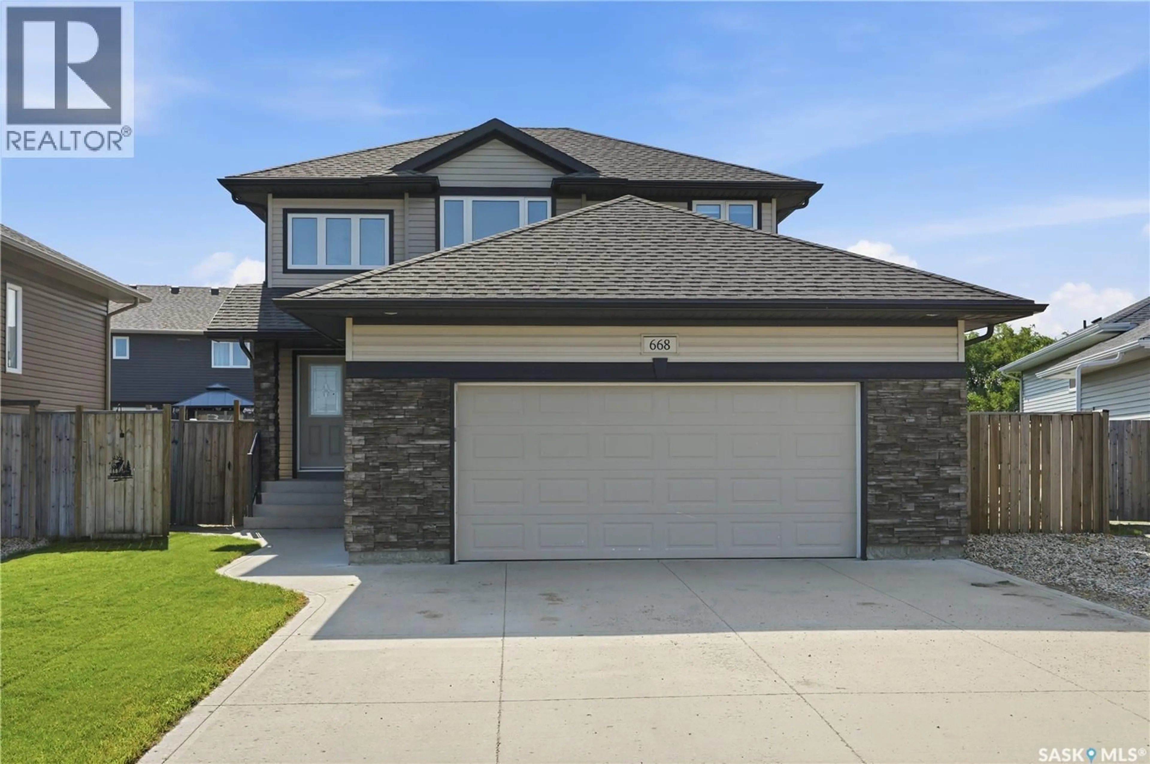 Home with brick exterior material, street for 668 LEHRER CRESCENT, Saskatoon Saskatchewan S7R0L2