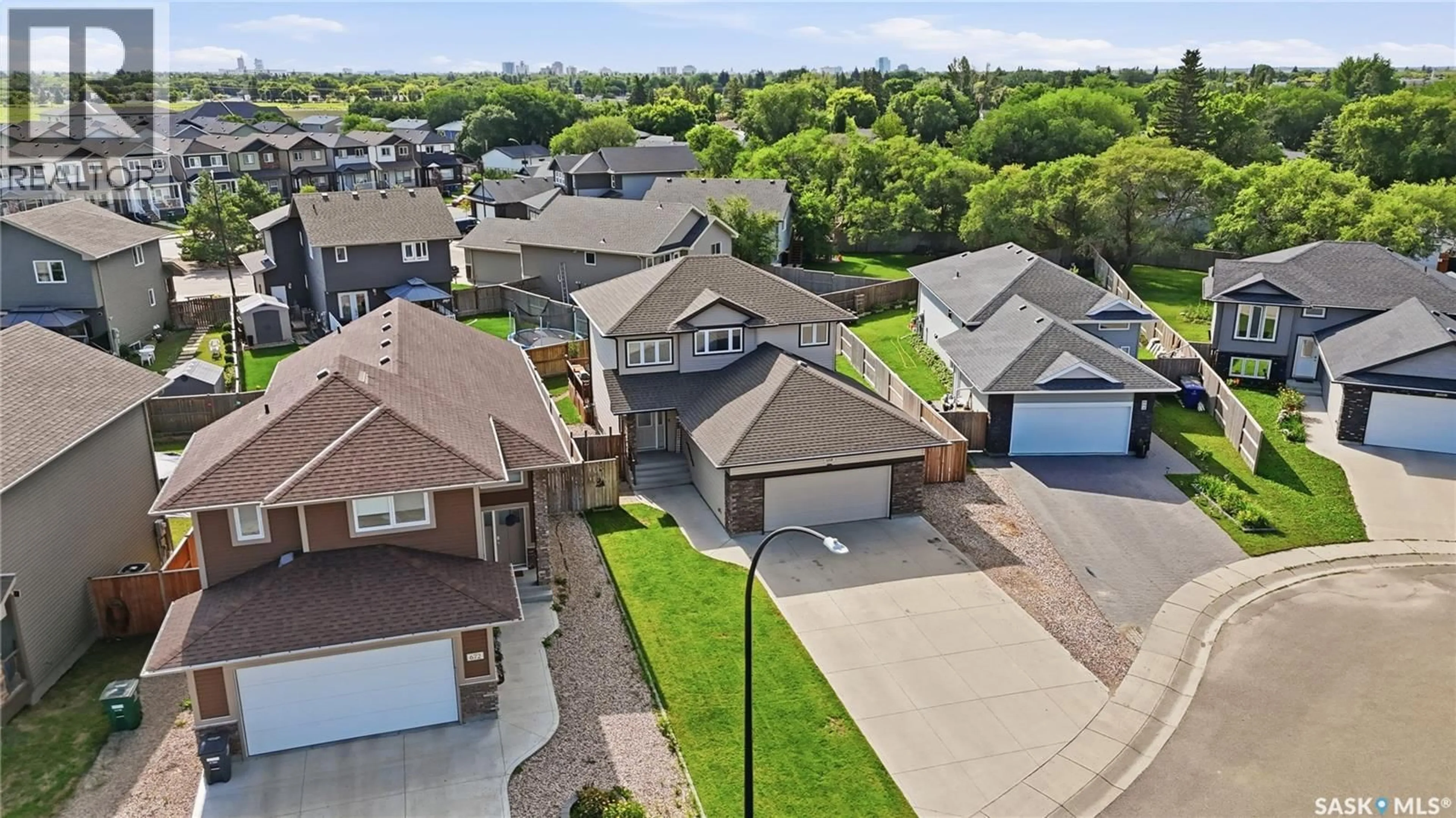 A pic from outside/outdoor area/front of a property/back of a property/a pic from drone, street for 668 LEHRER CRESCENT, Saskatoon Saskatchewan S7R0L2