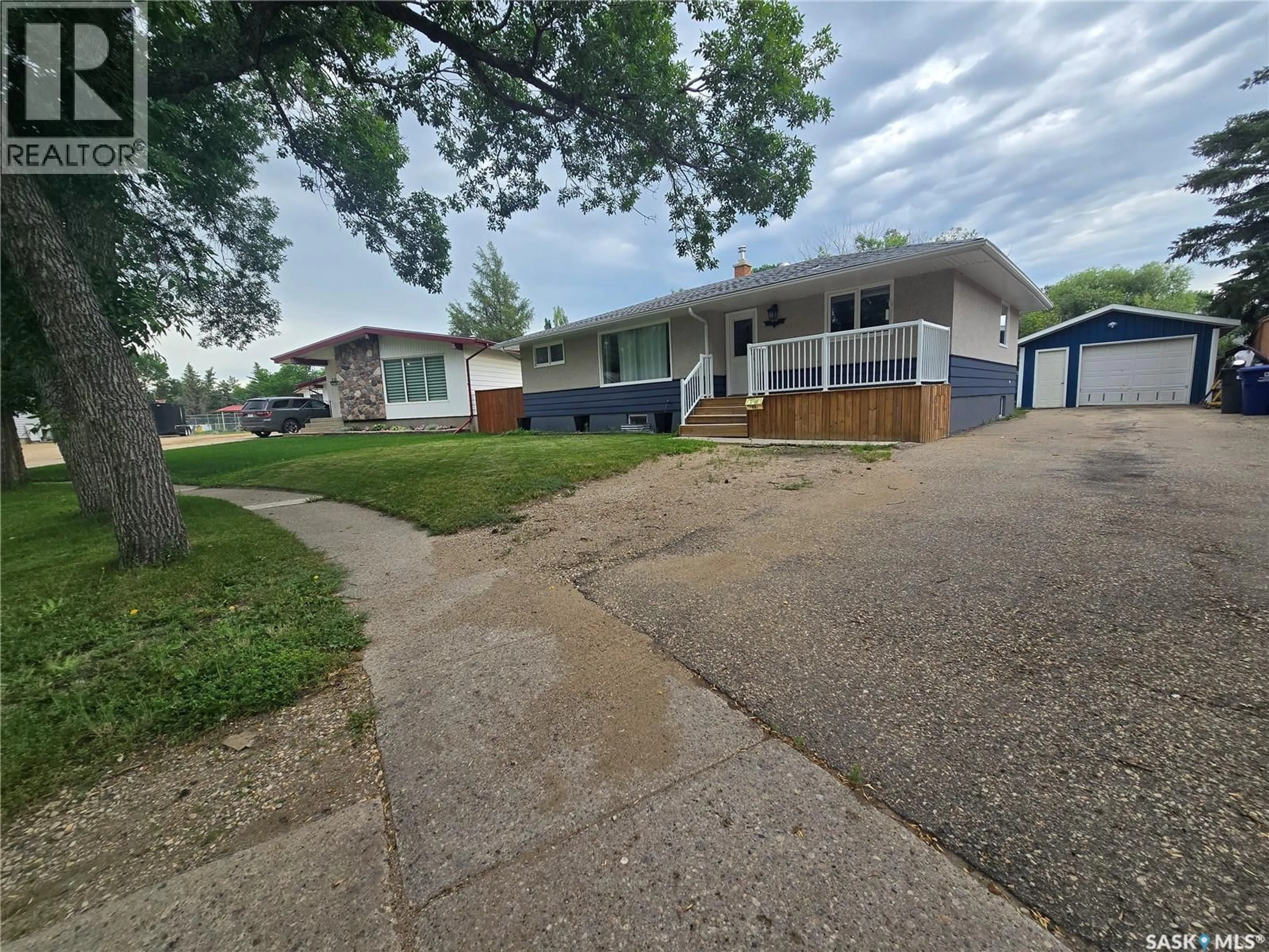 A pic from outside/outdoor area/front of a property/back of a property/a pic from drone, street for 98 13TH STREET, Weyburn Saskatchewan S4H1L1