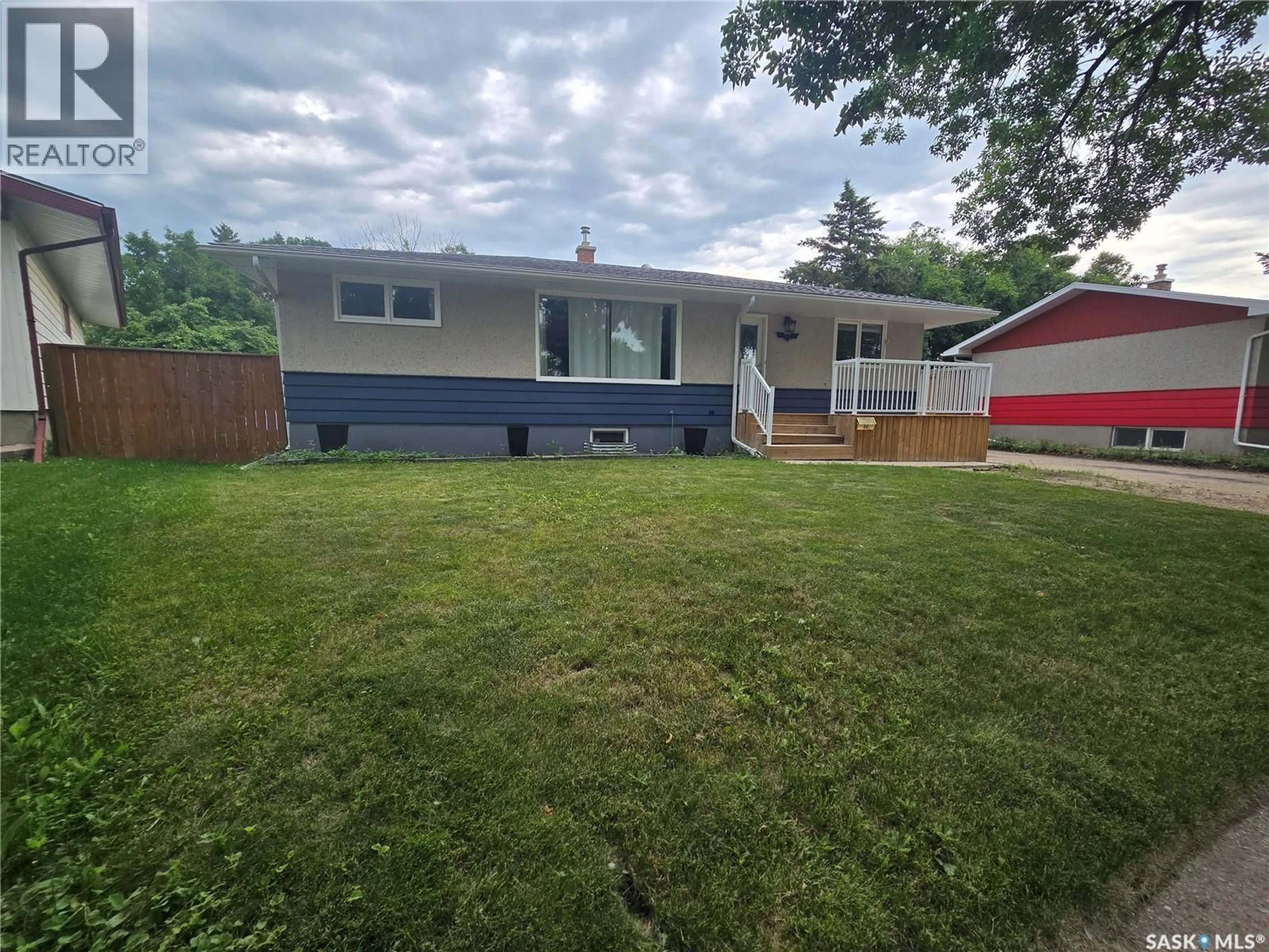 Home with vinyl exterior material, street for 98 13TH STREET, Weyburn Saskatchewan S4H1L1