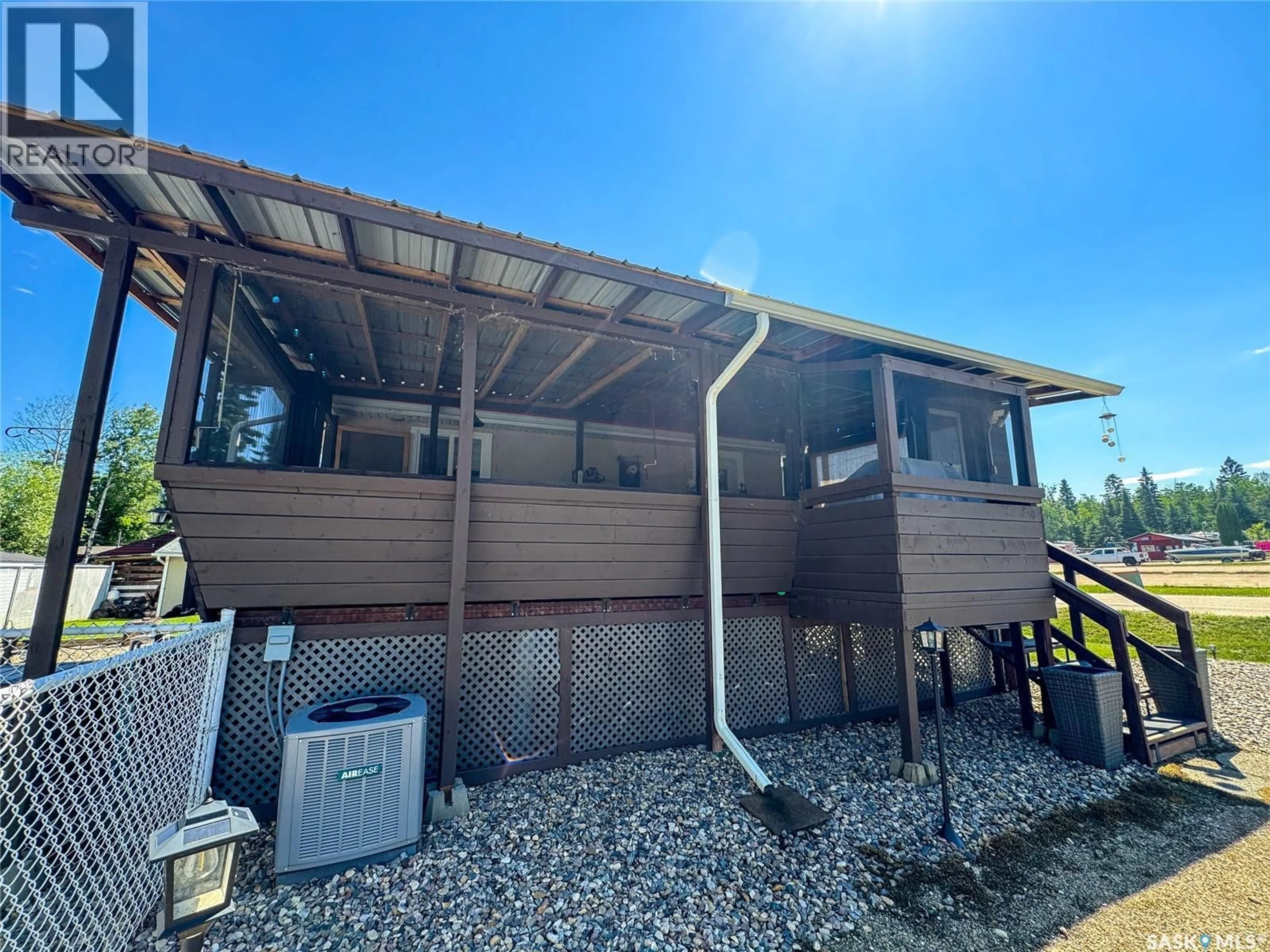 A pic from outside/outdoor area/front of a property/back of a property/a pic from drone, building for 504 SOUTHSHORE DRIVE, Emma Lake Saskatchewan S0J0N0
