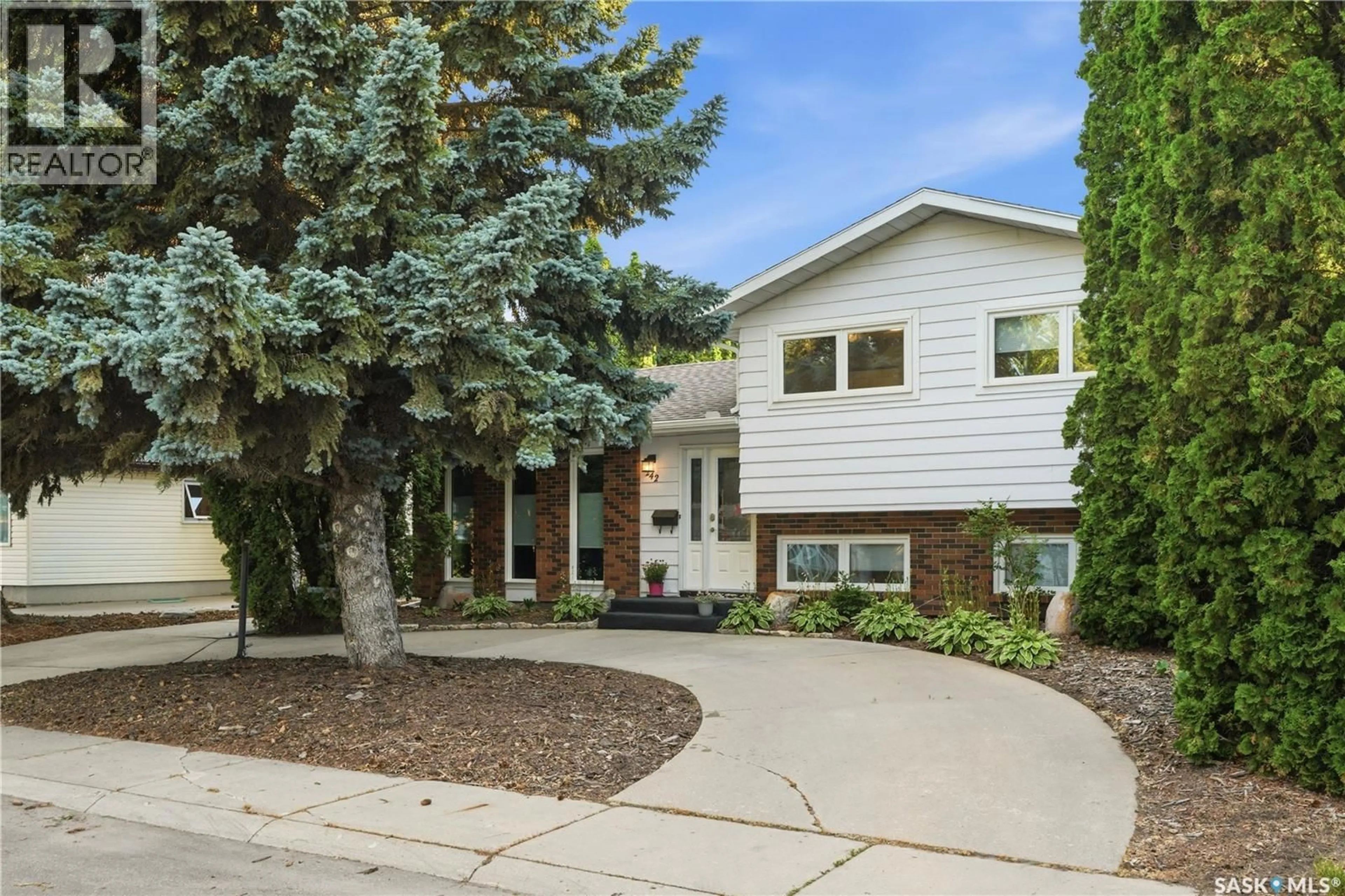 Home with vinyl exterior material, street for 242 CANDLE CRESCENT, Saskatoon Saskatchewan S7K5A4