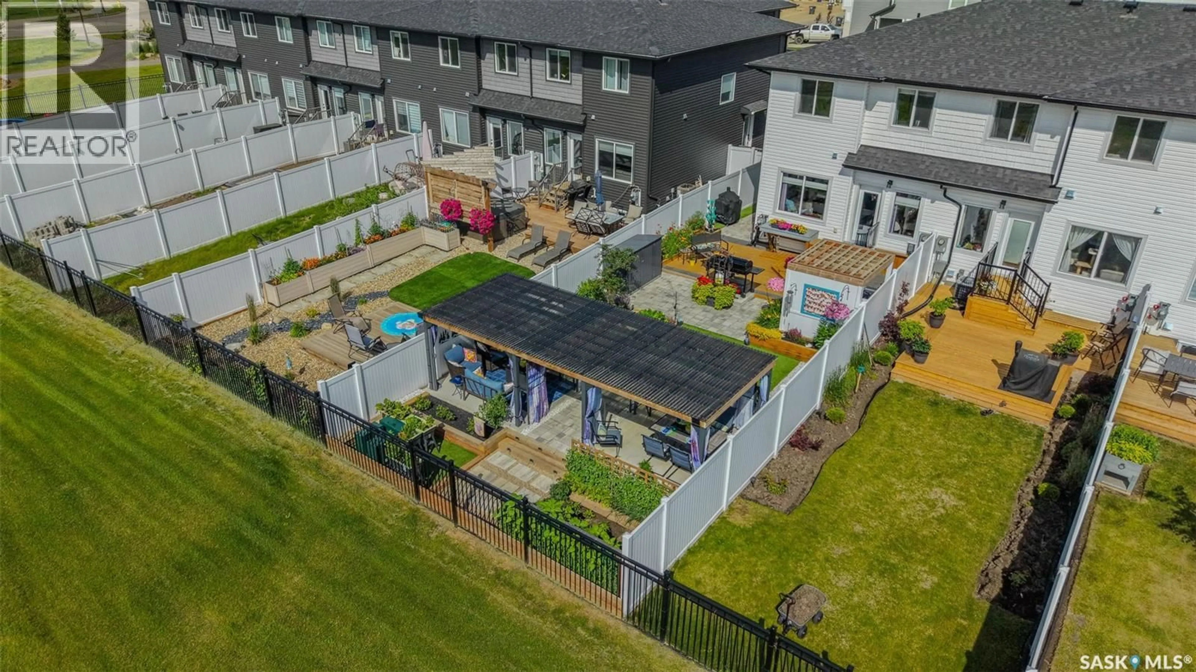 A pic from outside/outdoor area/front of a property/back of a property/a pic from drone, building for 848 BRIGHTON GATE, Saskatoon Saskatchewan S7V1L3