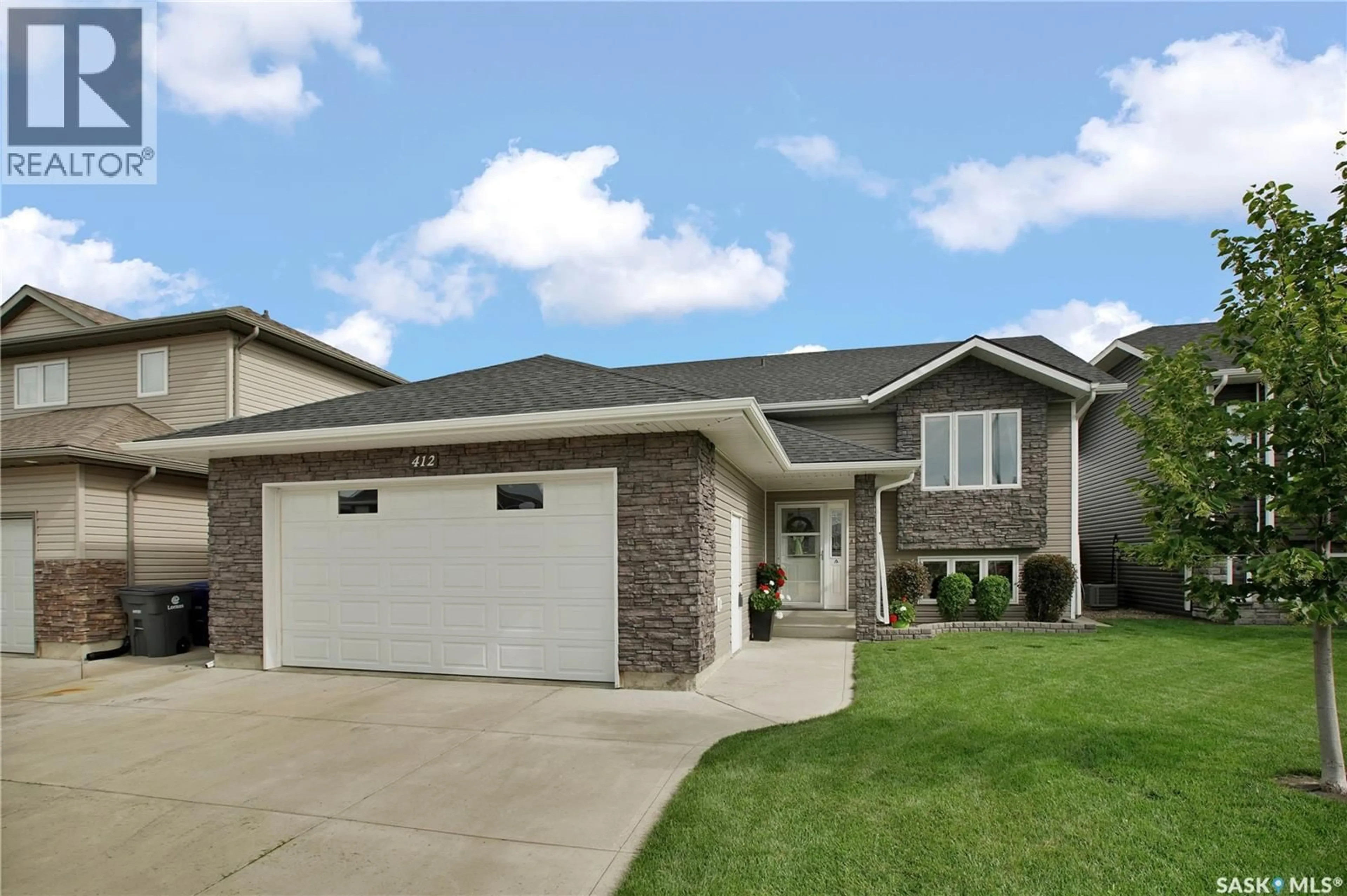 Home with vinyl exterior material, street for 412 LYLE CRESCENT, Warman Saskatchewan S0K4S1