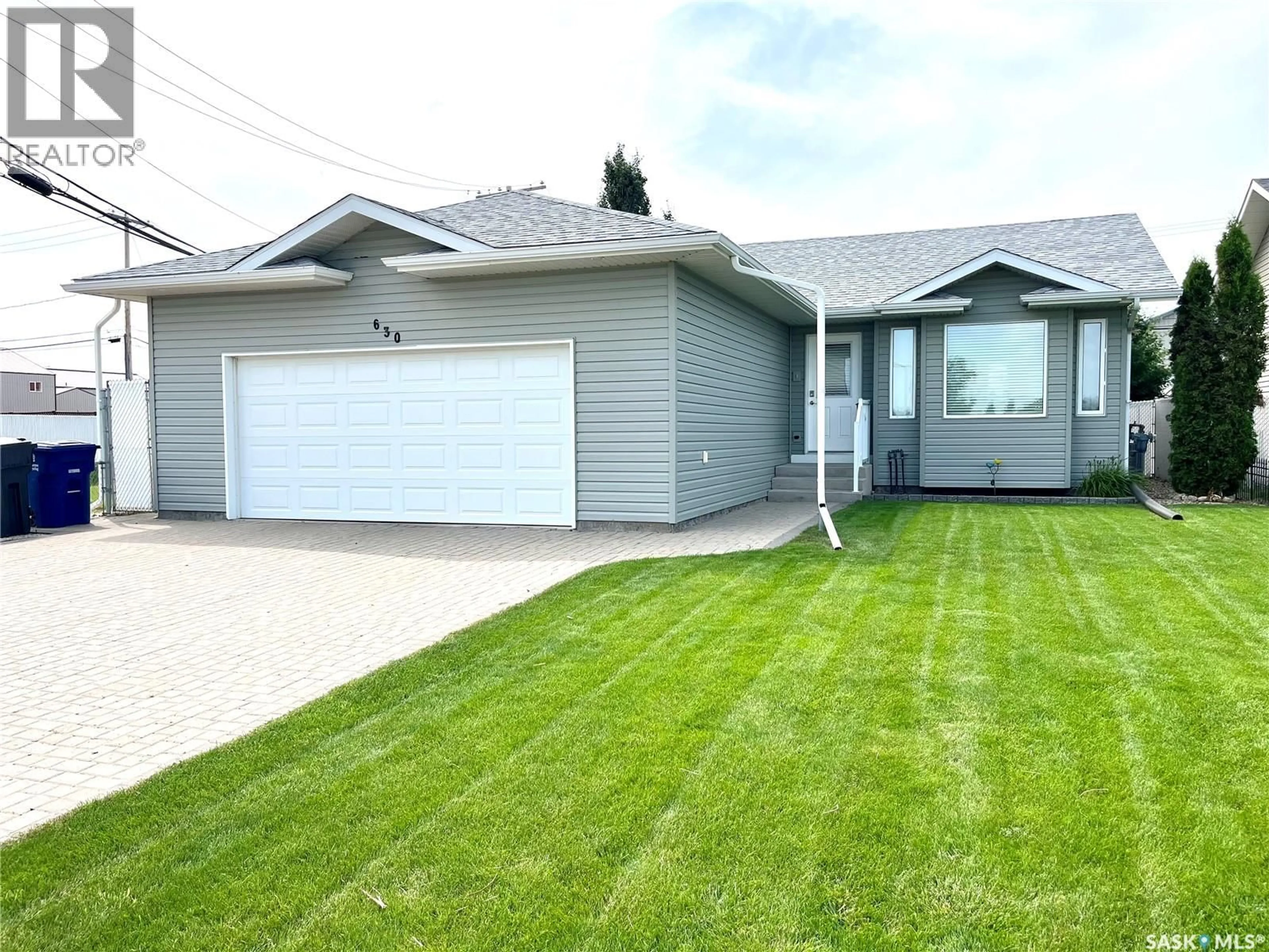 Home with vinyl exterior material, street for 630 1ST AVENUE, Martensville Saskatchewan S0K2T2