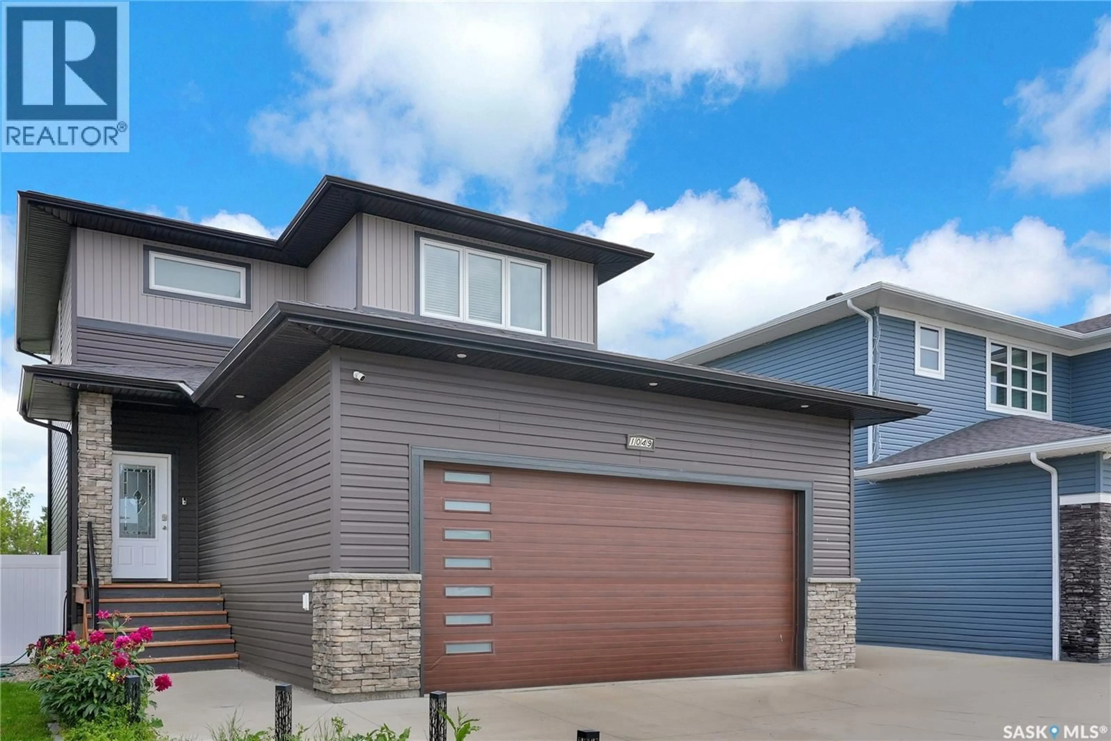 Home with brick exterior material, street for 1049 MAPLEWOOD DRIVE, Moose Jaw Saskatchewan S6J0B6