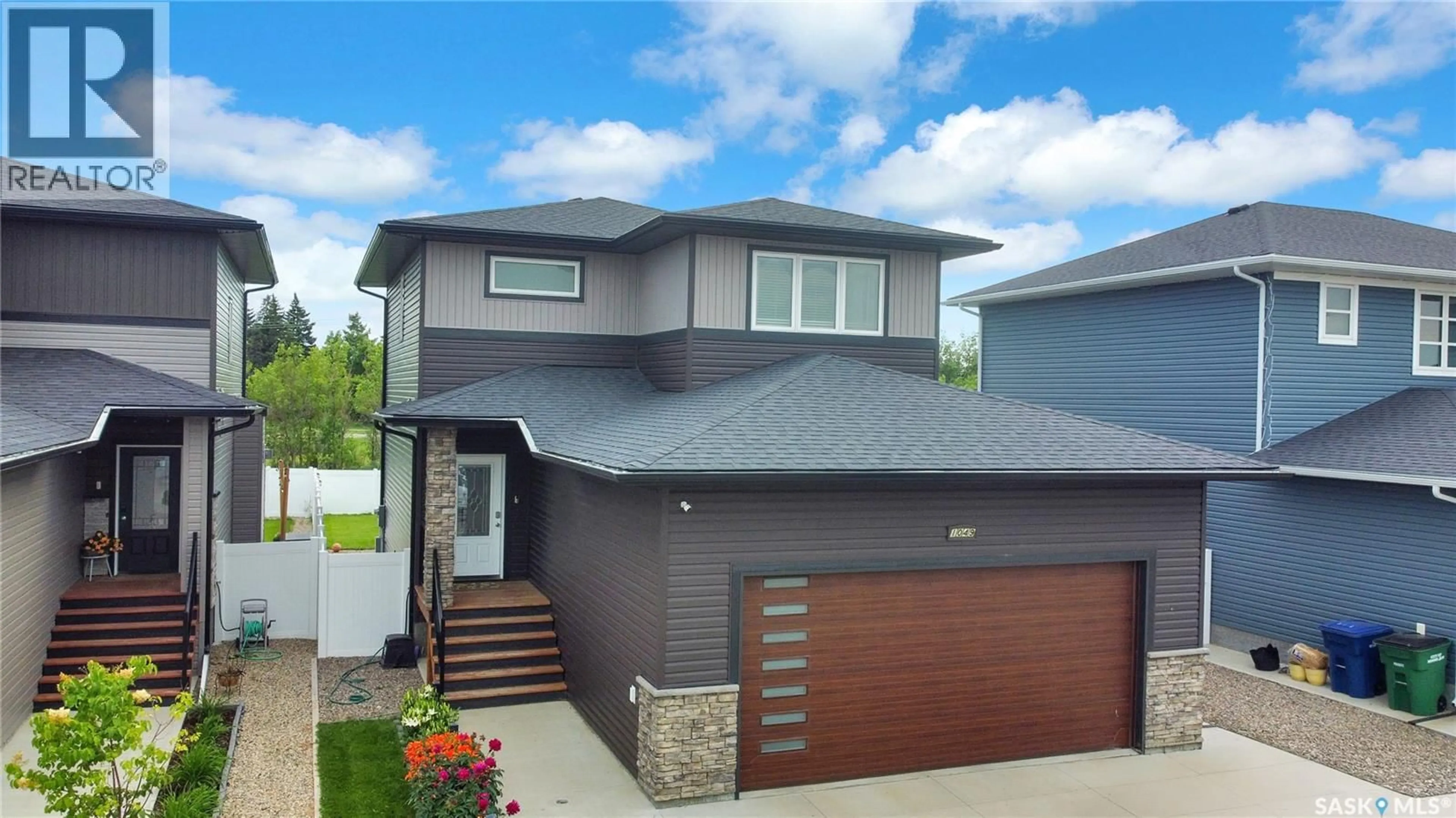 Home with brick exterior material, street for 1049 MAPLEWOOD DRIVE, Moose Jaw Saskatchewan S6J0B6