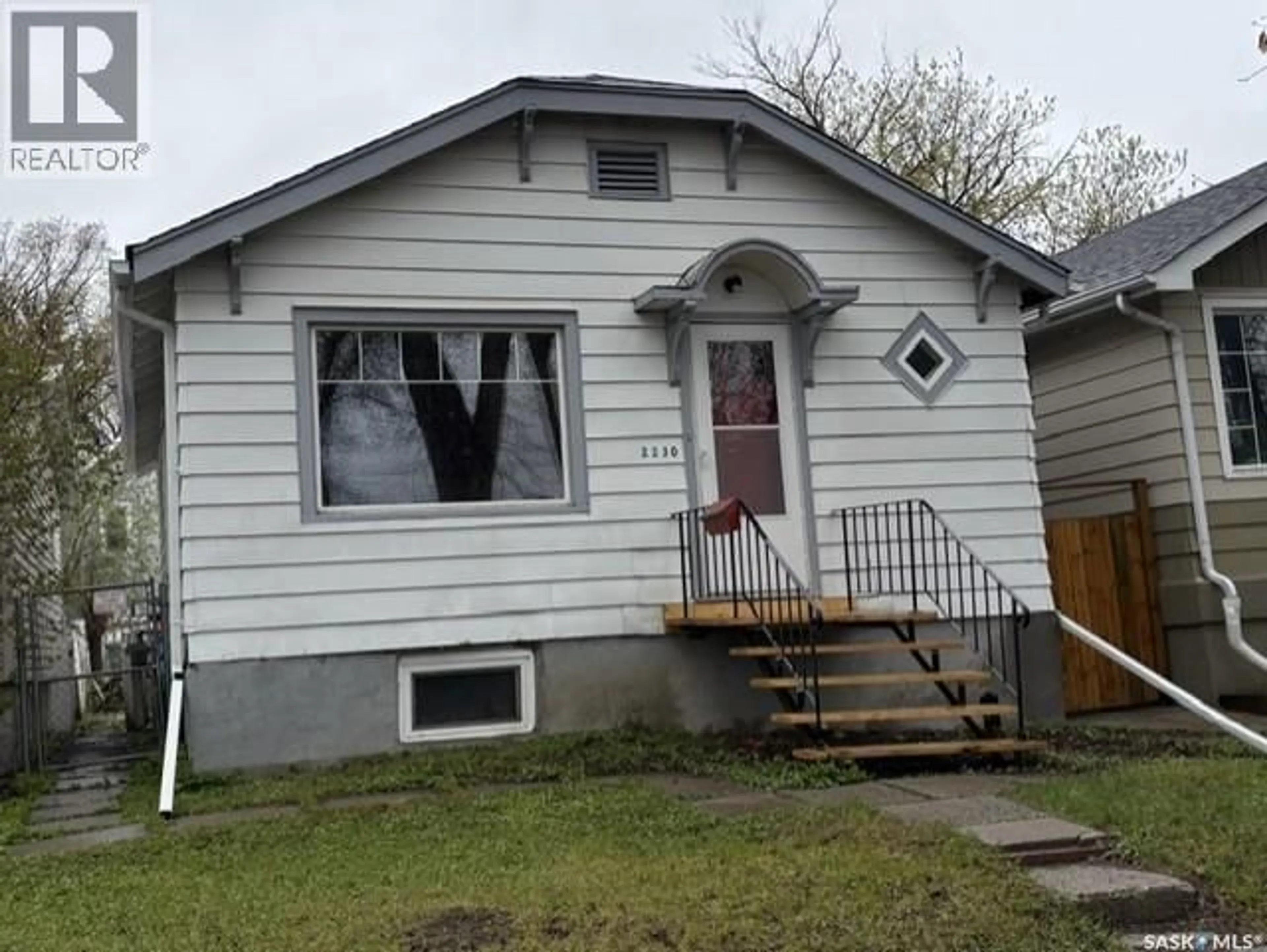 Home with vinyl exterior material, street for 2230 WINNIPEG STREET, Regina Saskatchewan S4P1H1