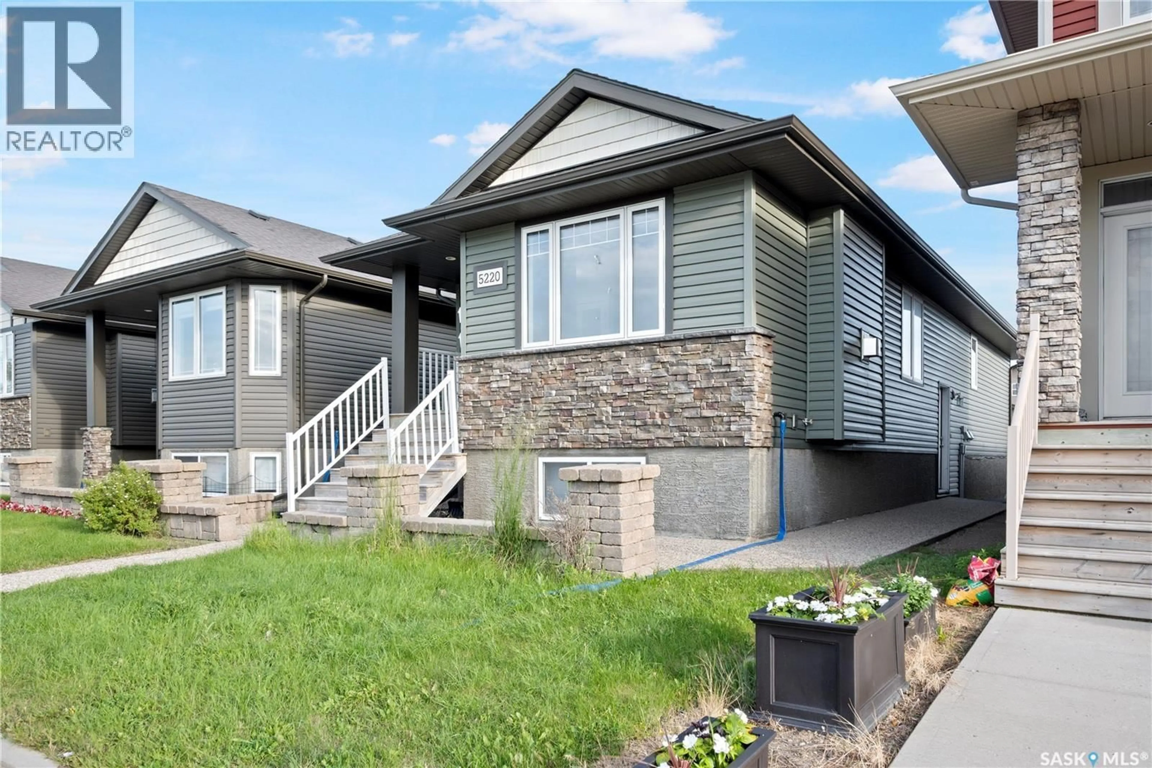 Home with vinyl exterior material, street for 5220 AERIAL CRESCENT, Regina Saskatchewan S4W0C8
