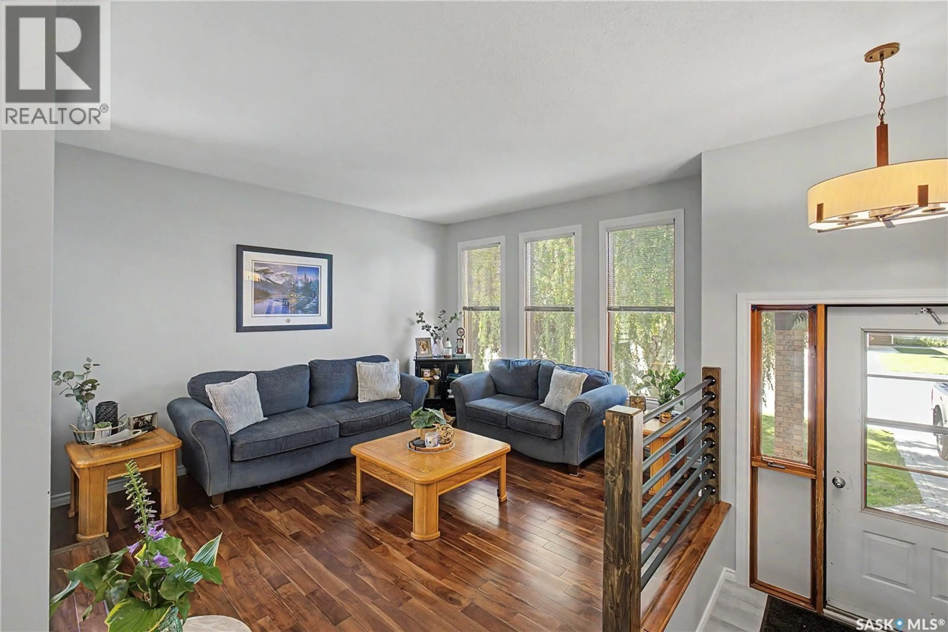 Living room with furniture, wood/laminate floor for 1791 BARTON DRIVE, Prince Albert Saskatchewan S6V7W1