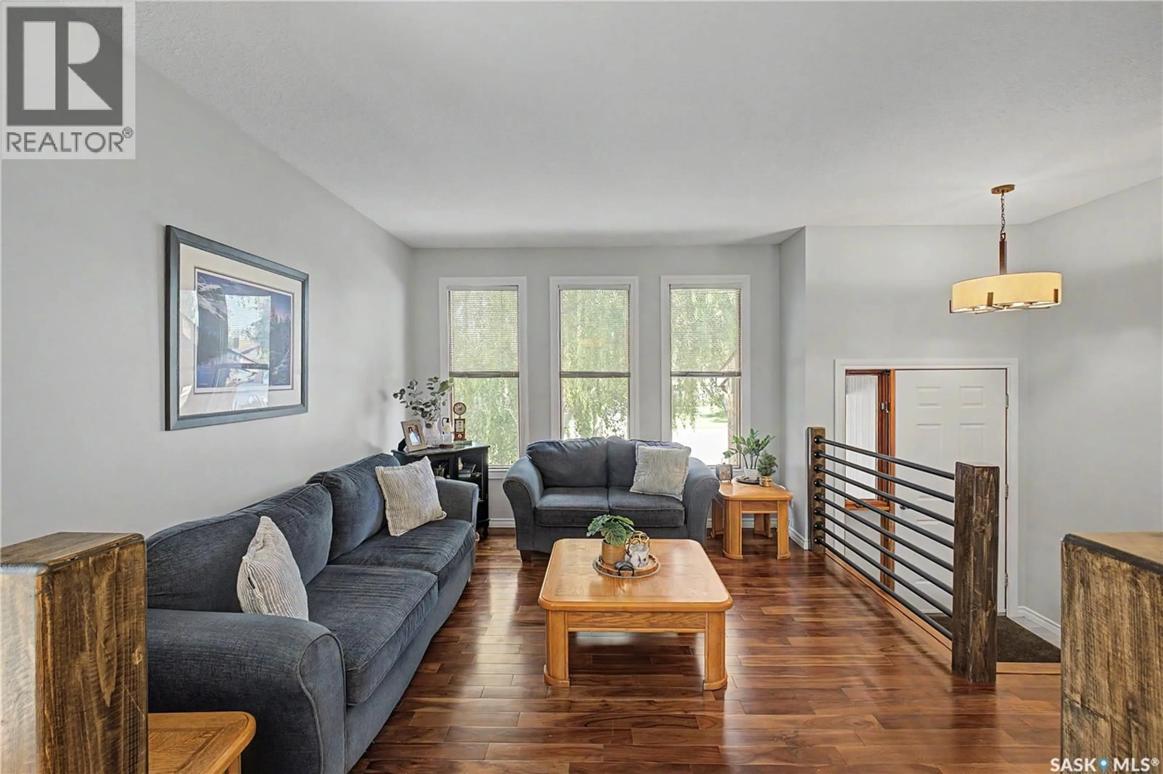 Living room with furniture, wood/laminate floor for 1791 BARTON DRIVE, Prince Albert Saskatchewan S6V7W1