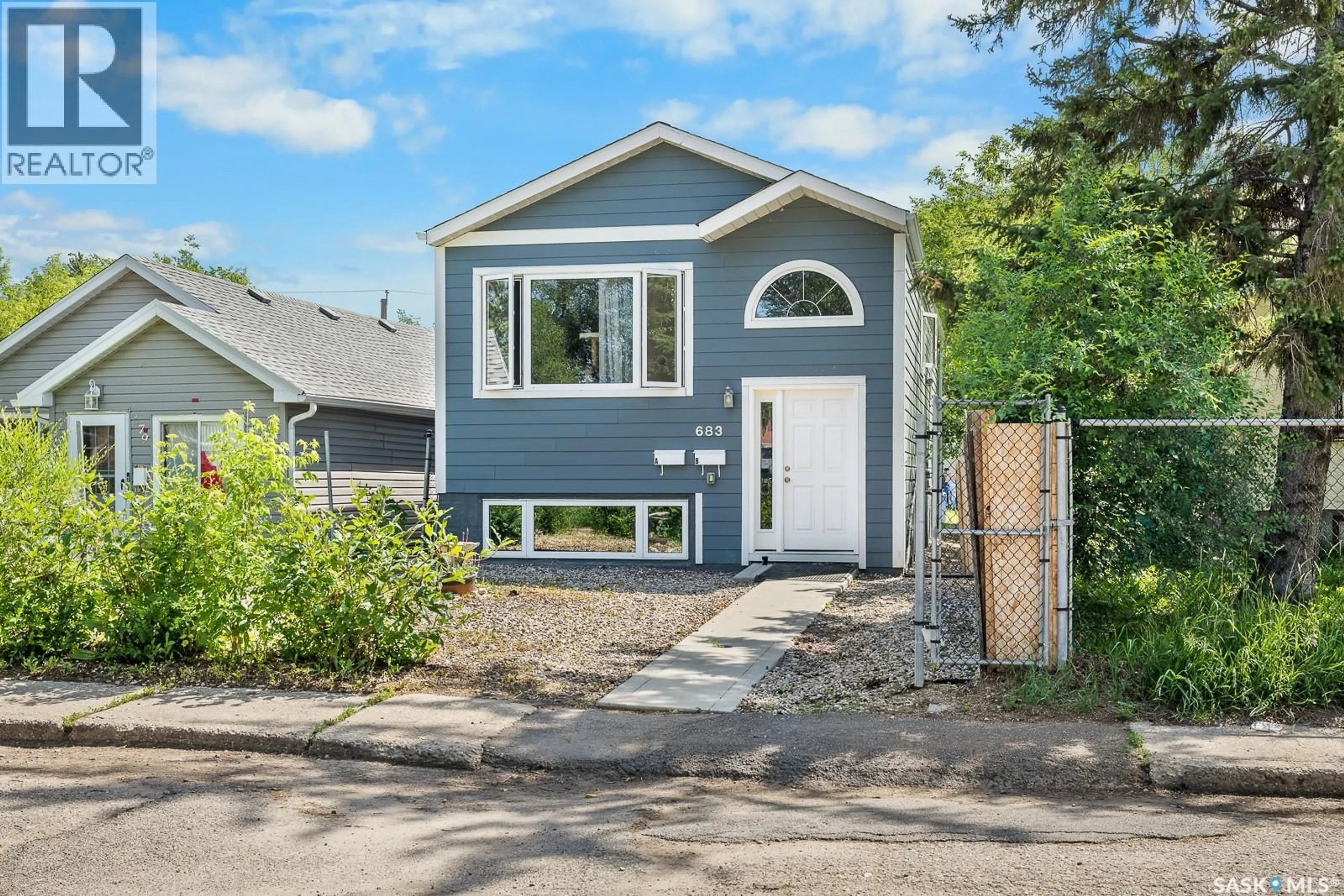 Home with vinyl exterior material, street for A&B - 683 GARNET STREET, Regina Saskatchewan S4T2W9