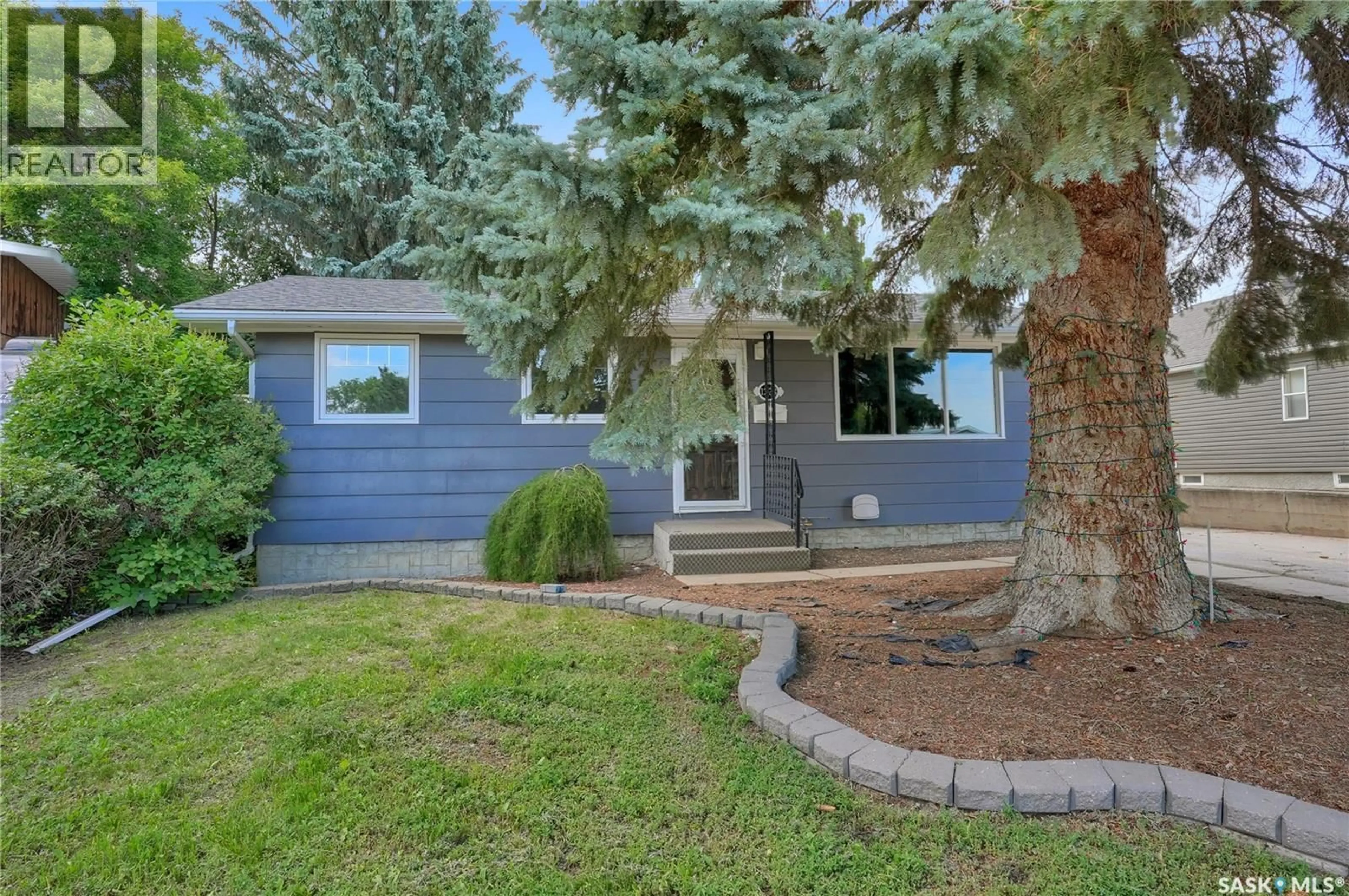 Home with vinyl exterior material, street for 1228 ATHABASCA STREET, Moose Jaw Saskatchewan S6H6C6