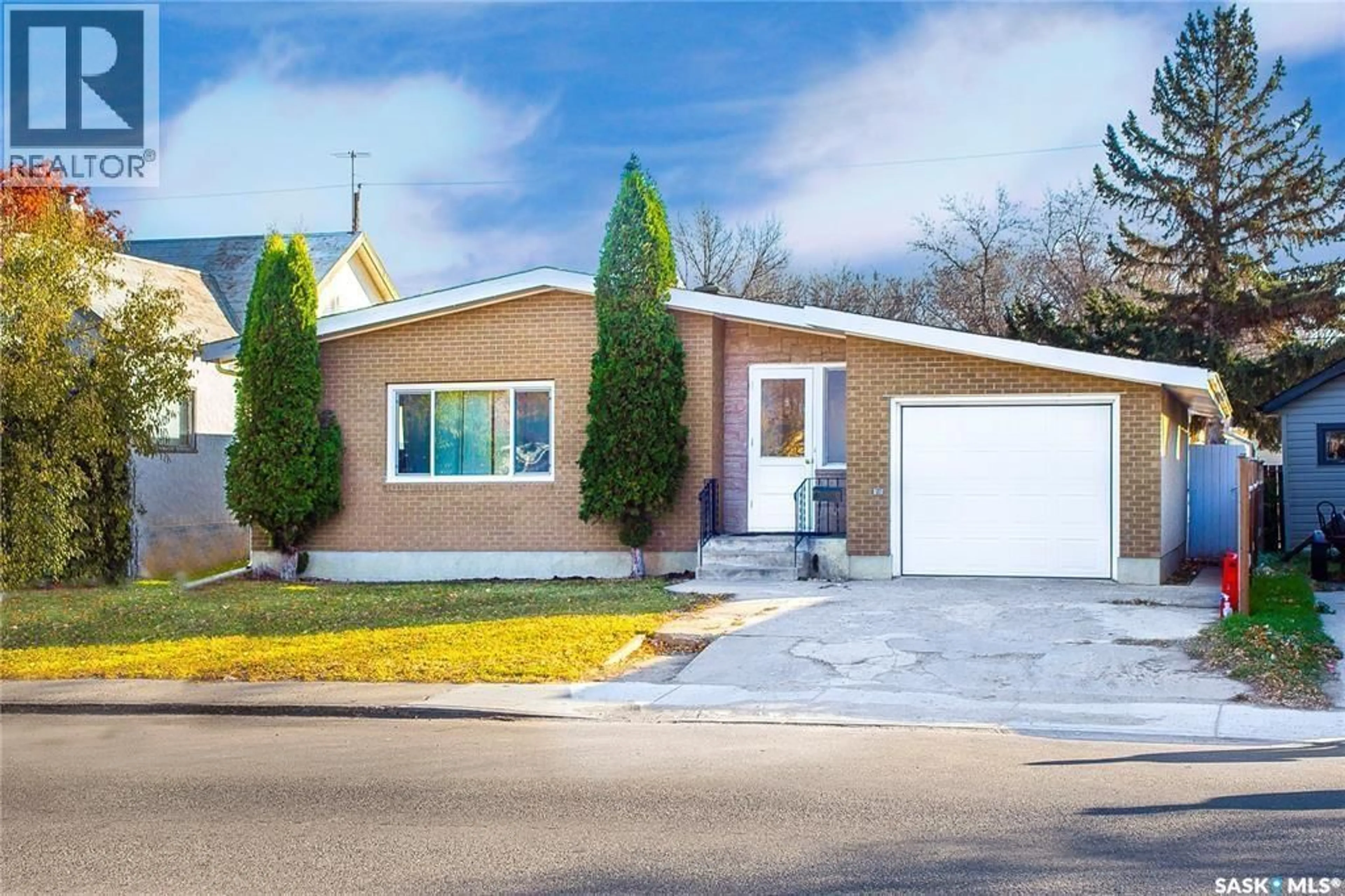 Home with vinyl exterior material, street for 1818 C AVENUE, Saskatoon Saskatchewan S7L1L8
