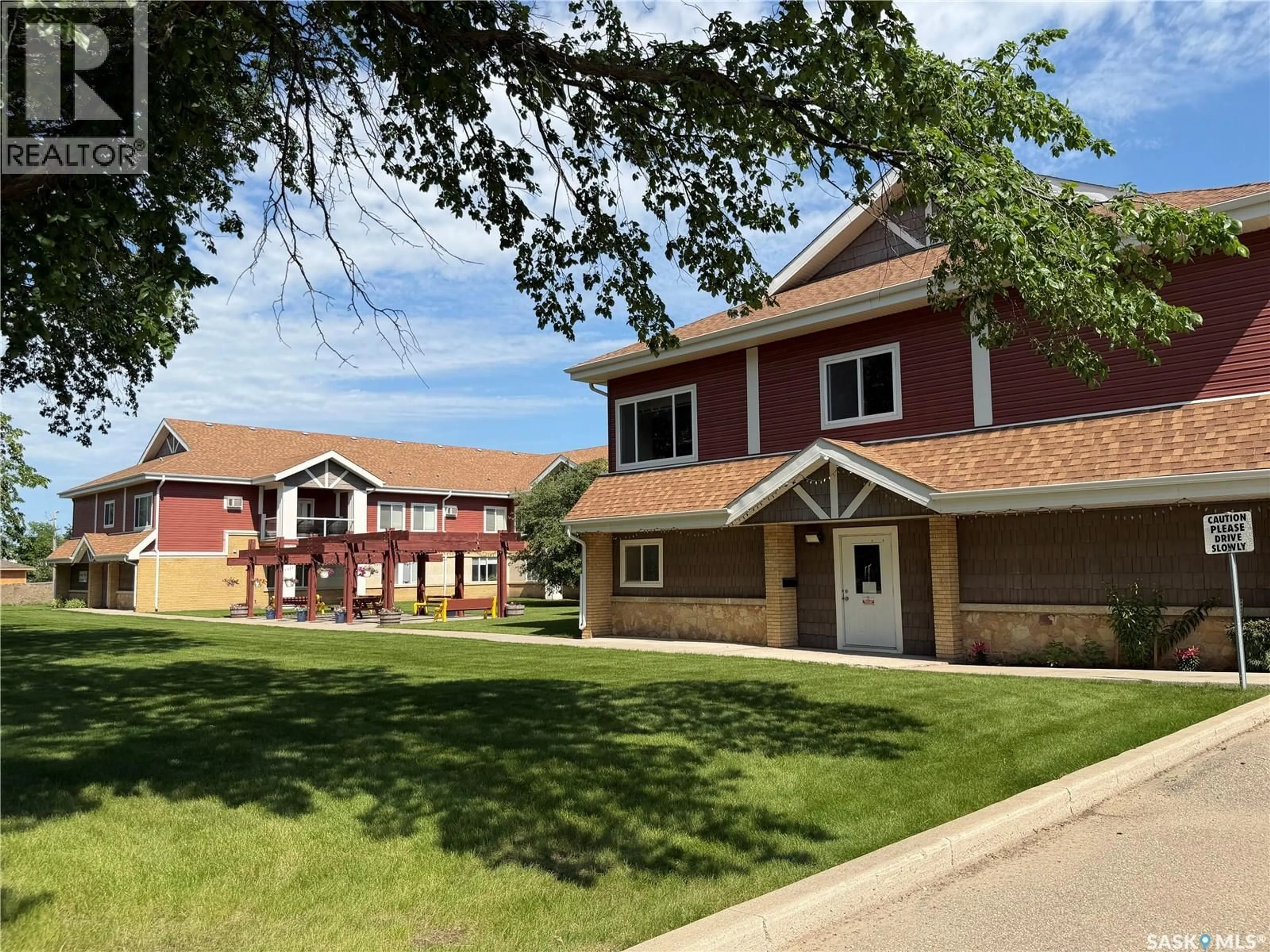 A pic from outside/outdoor area/front of a property/back of a property/a pic from drone, street for 302 - 109 BEMISTER AVENUE E, Melfort Saskatchewan S0E1A0
