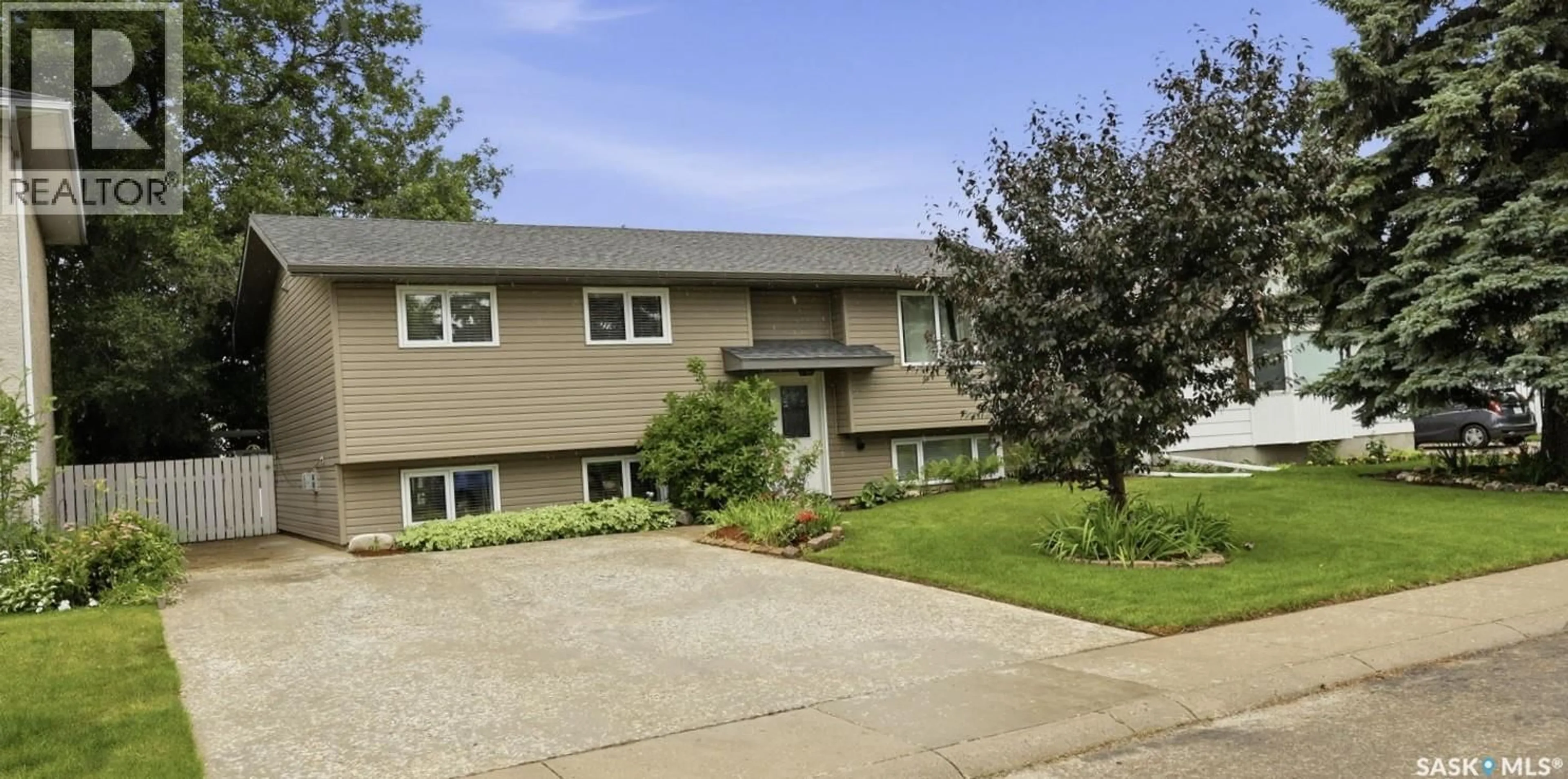 Home with vinyl exterior material, street for 210 LAVAL CRESCENT, Saskatoon Saskatchewan S7H4K7