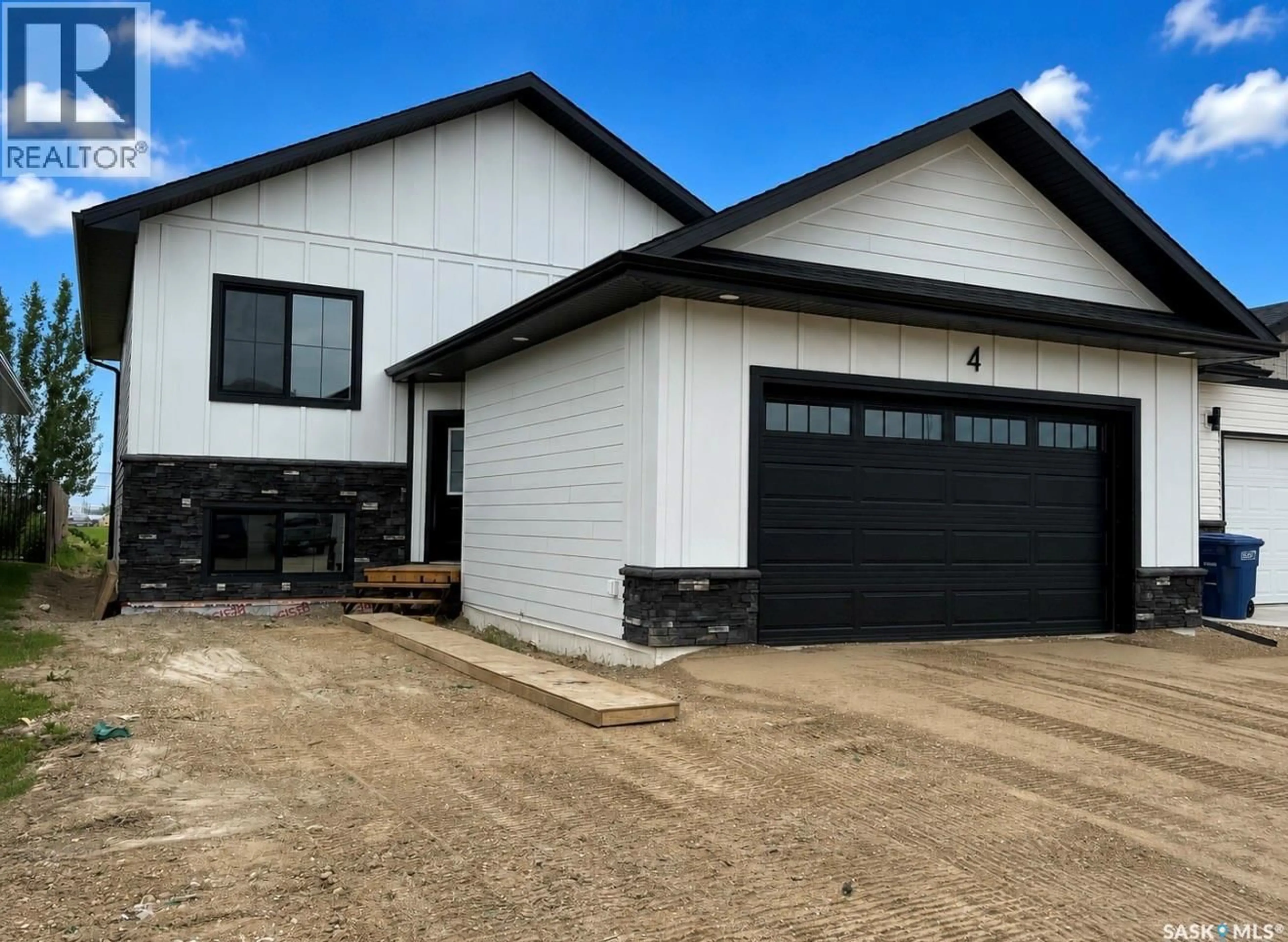 Home with vinyl exterior material, street for 4 ASPEN PLACE, Humboldt Saskatchewan S0K2A0