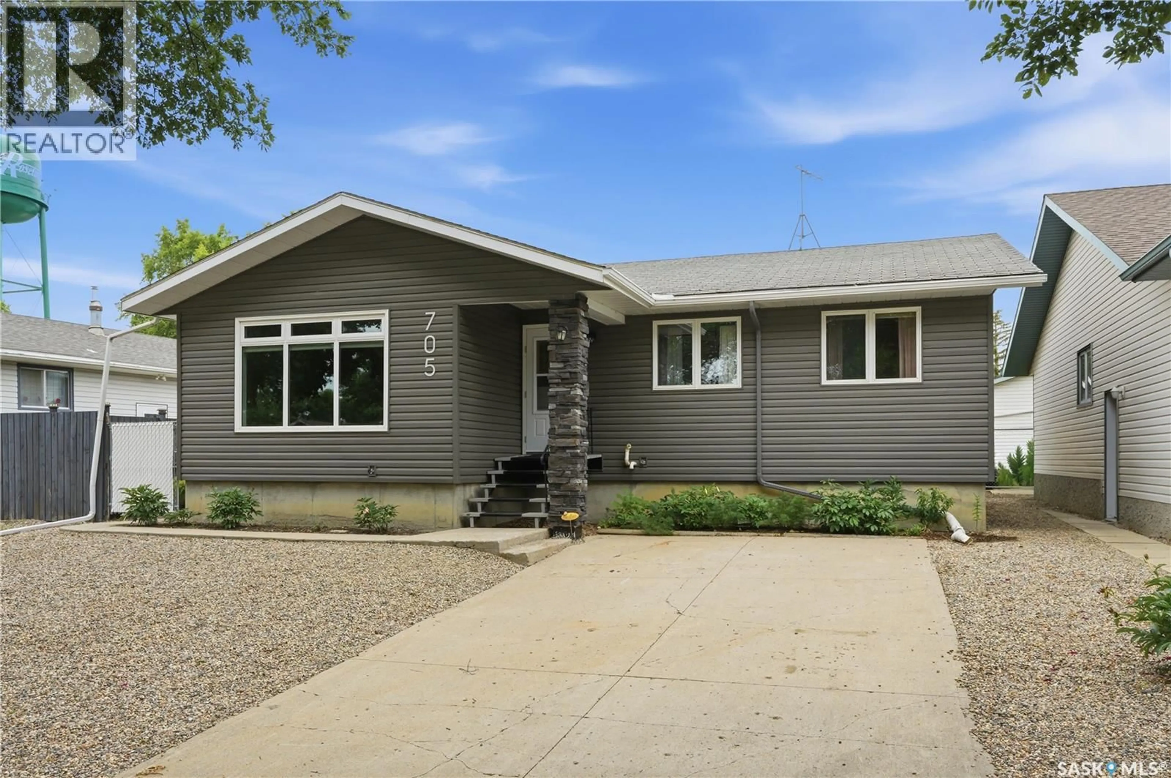 Home with vinyl exterior material, street for 705 MAIN STREET, Rosetown Saskatchewan S0L2V0