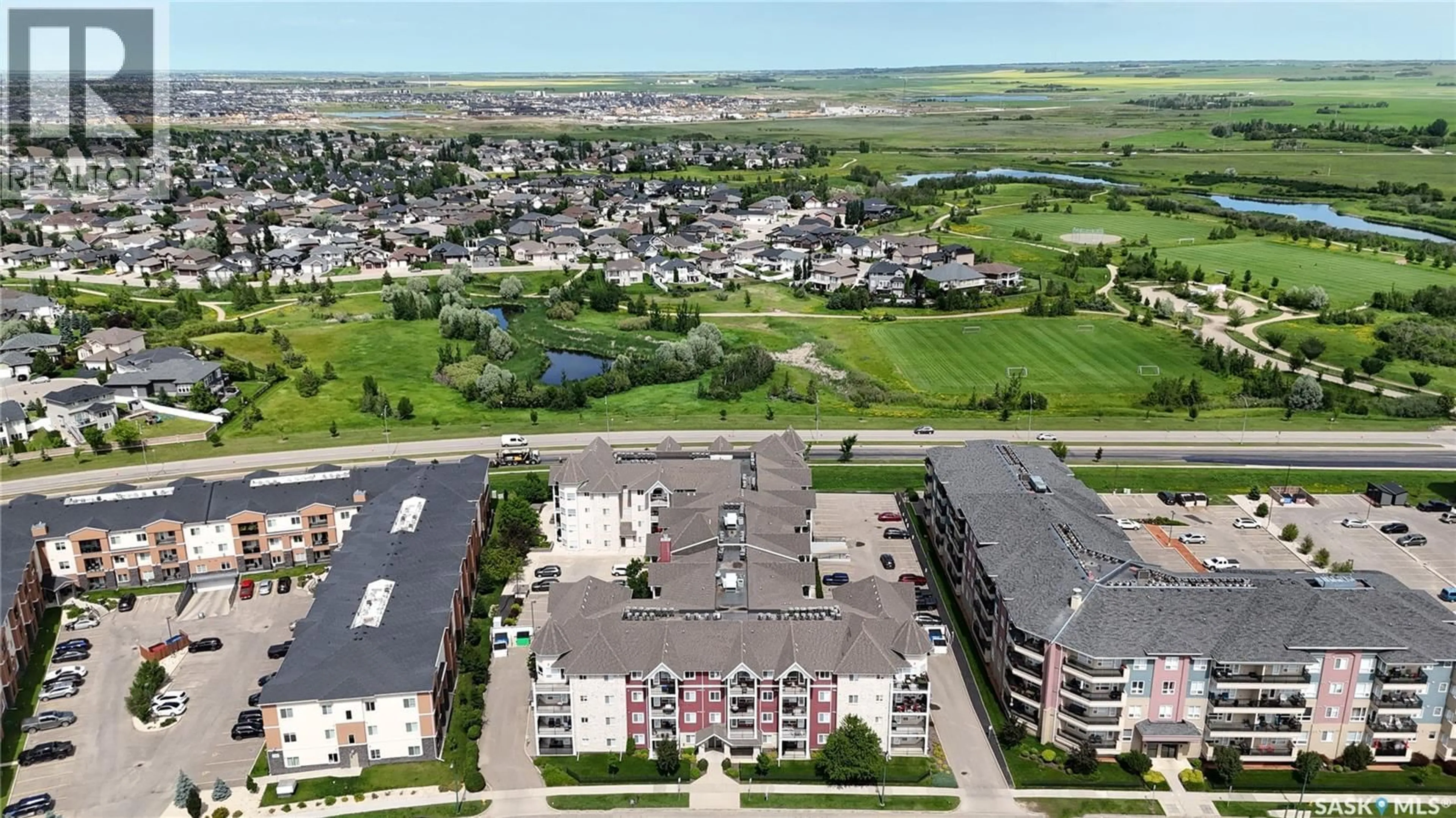 A pic from outside/outdoor area/front of a property/back of a property/a pic from drone, unknown for 404 150 PAWLYCHENKO LANE, Saskatoon Saskatchewan S7V0B4