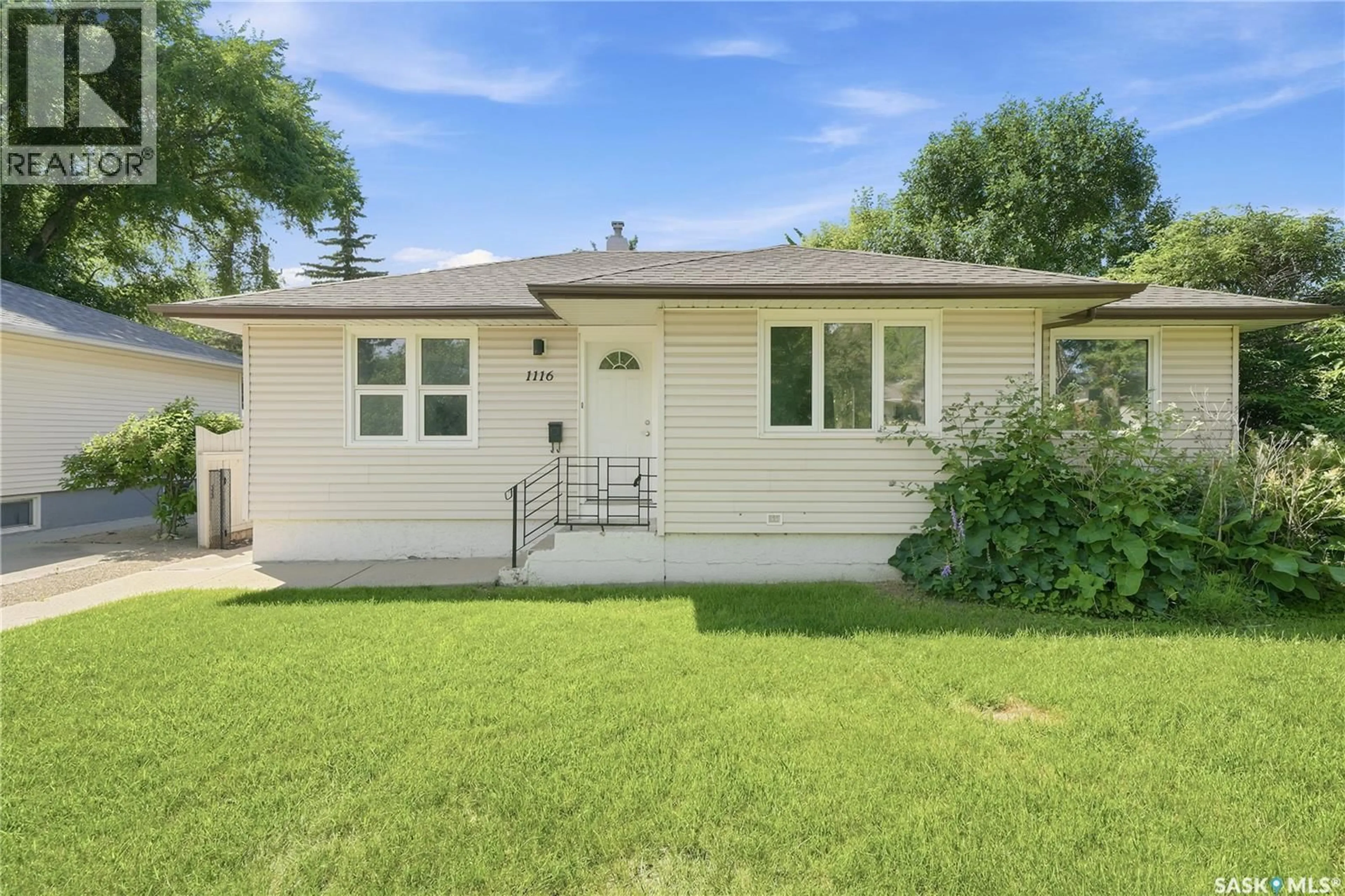 Home with vinyl exterior material, street for 1116 EWART AVENUE, Saskatoon Saskatchewan S7H2K3
