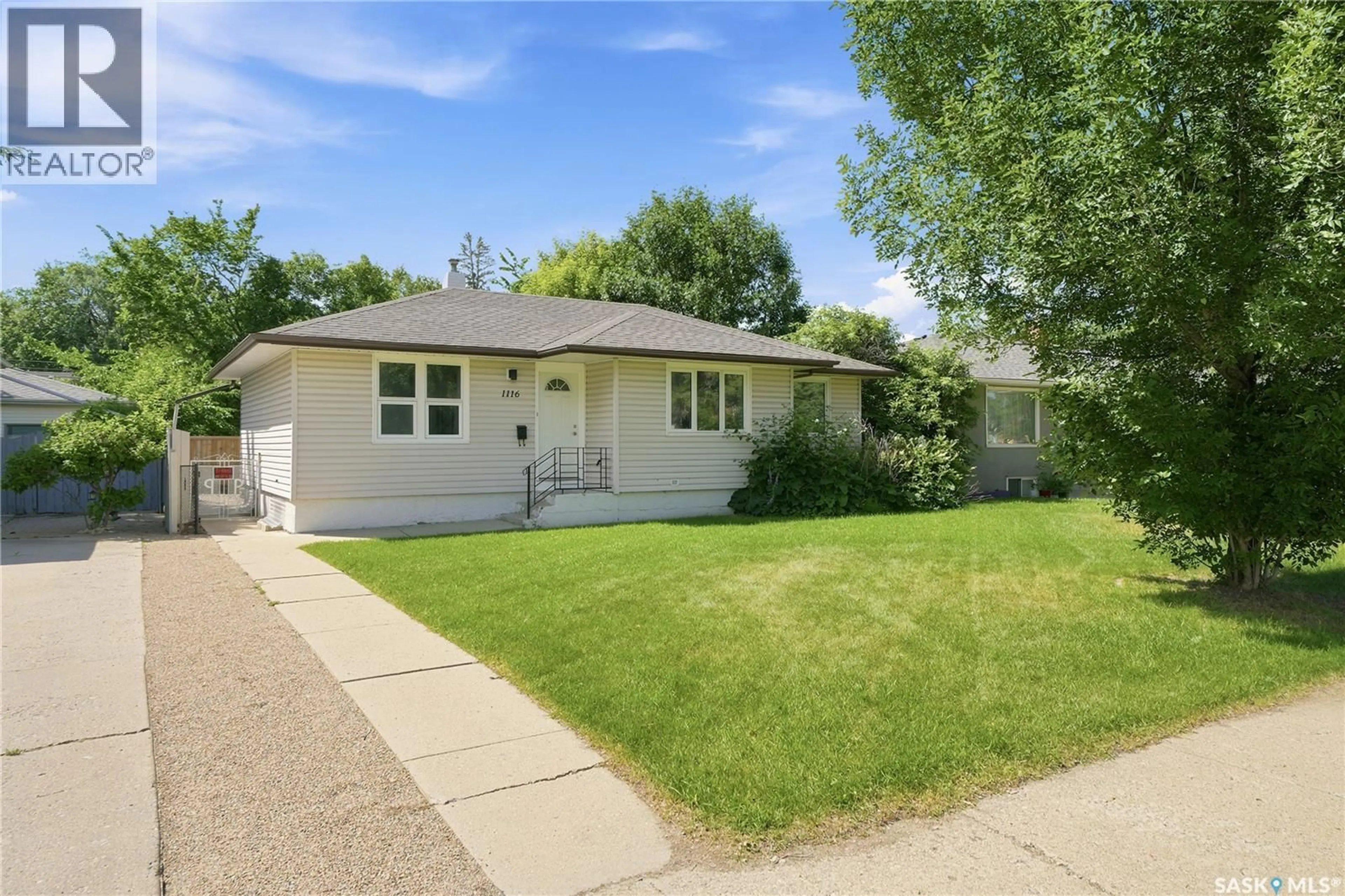Home with vinyl exterior material, street for 1116 EWART AVENUE, Saskatoon Saskatchewan S7H2K3