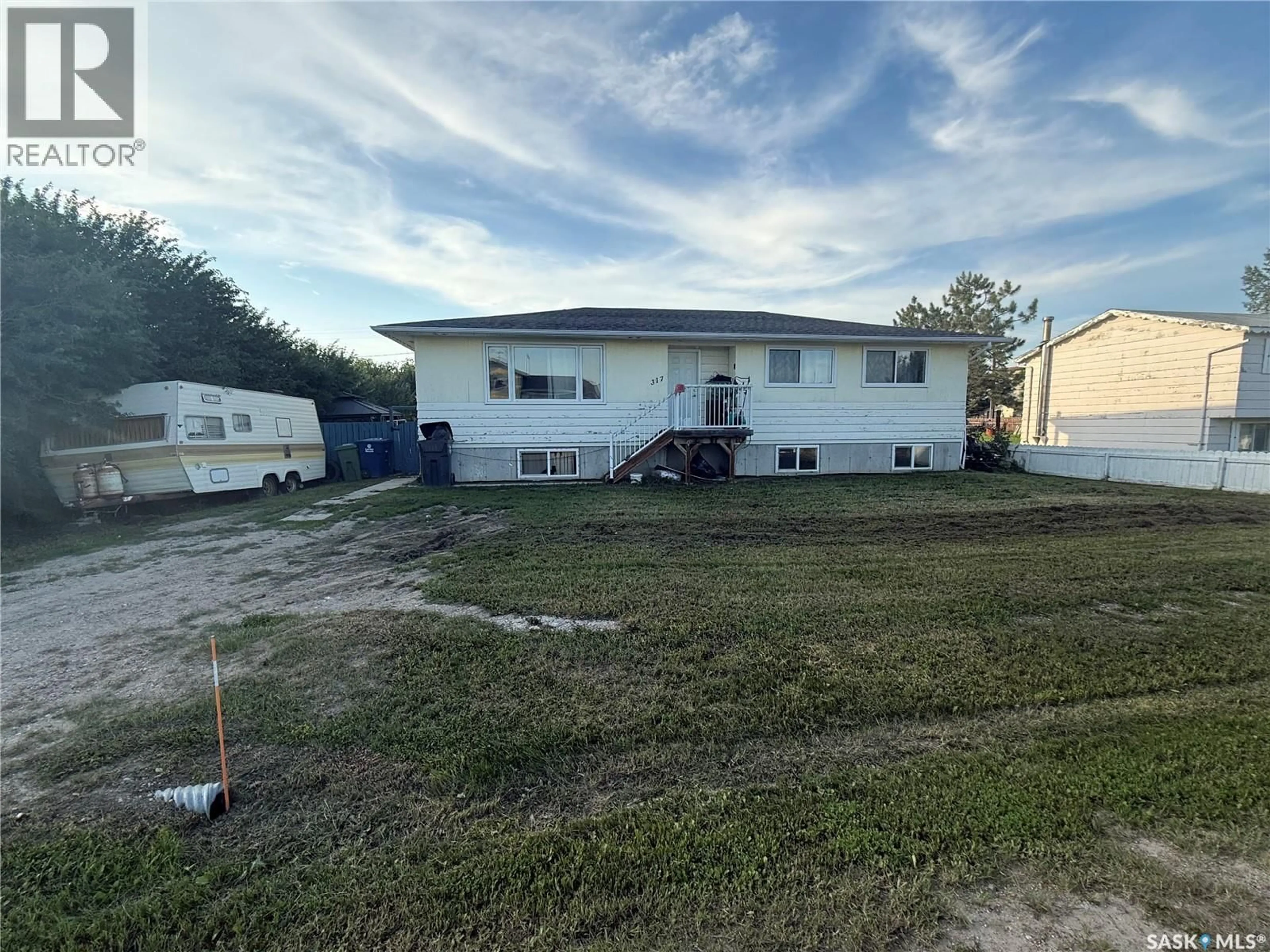 A pic from outside/outdoor area/front of a property/back of a property/a pic from drone, building for 317 CARSON STREET, Dundurn Saskatchewan S0K1K0