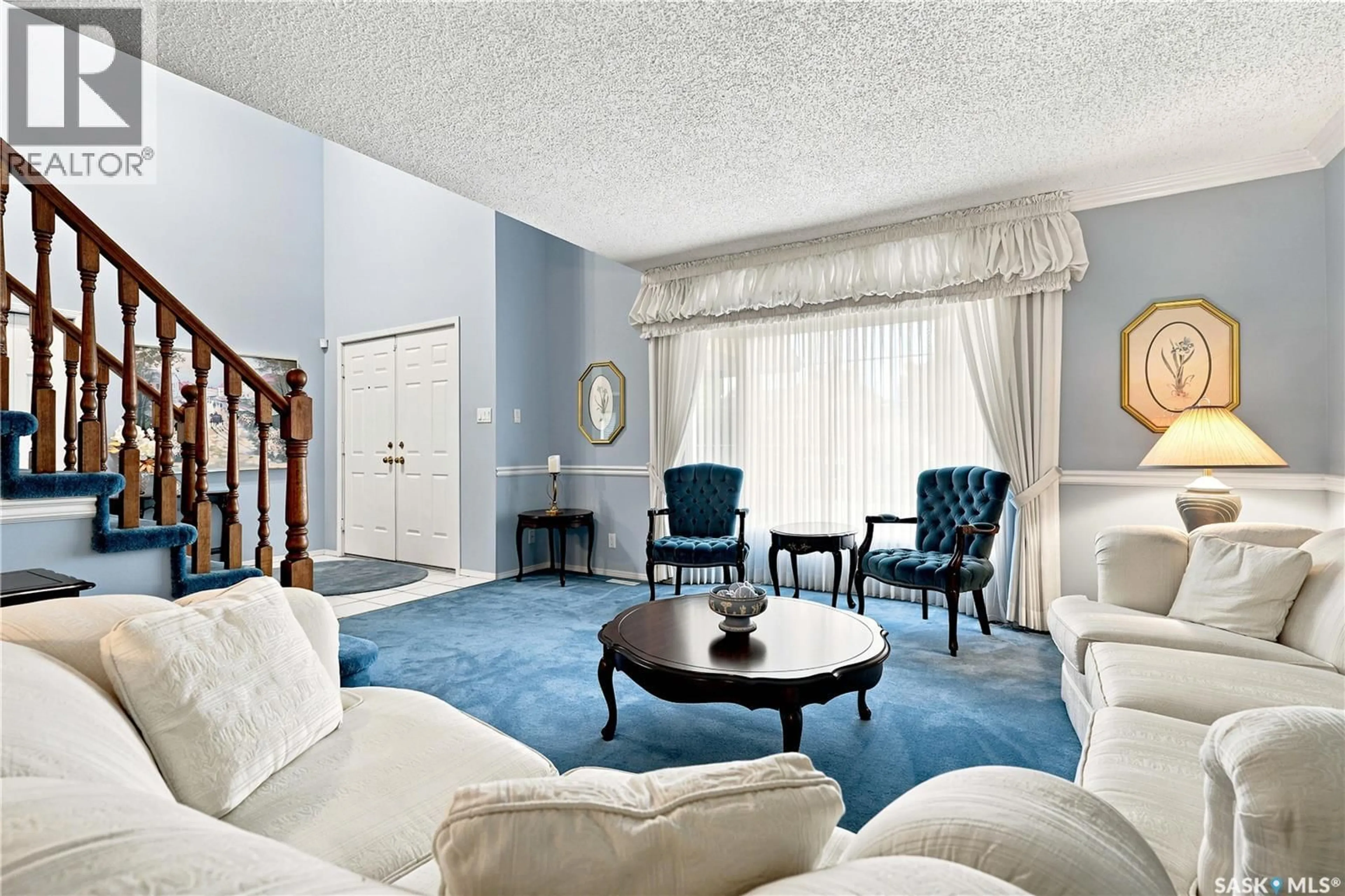 Living room with furniture, carpet floor for 711 WHITEWOOD COURT, Saskatoon Saskatchewan S7J4K5