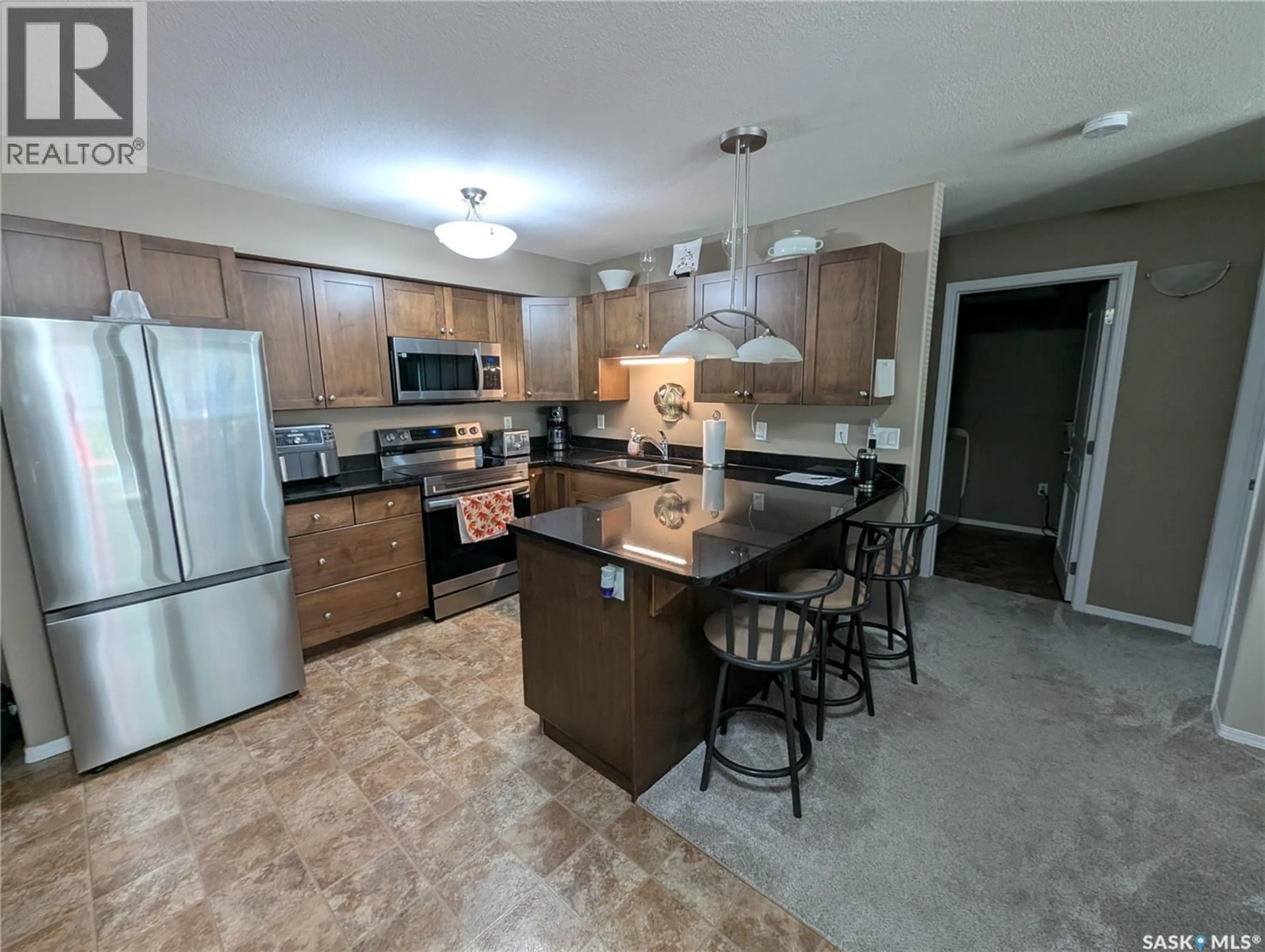Open concept kitchen, ceramic/tile floor for 111 150 PAWLYCHENKO LANE, Saskatoon Saskatchewan S7V0B4