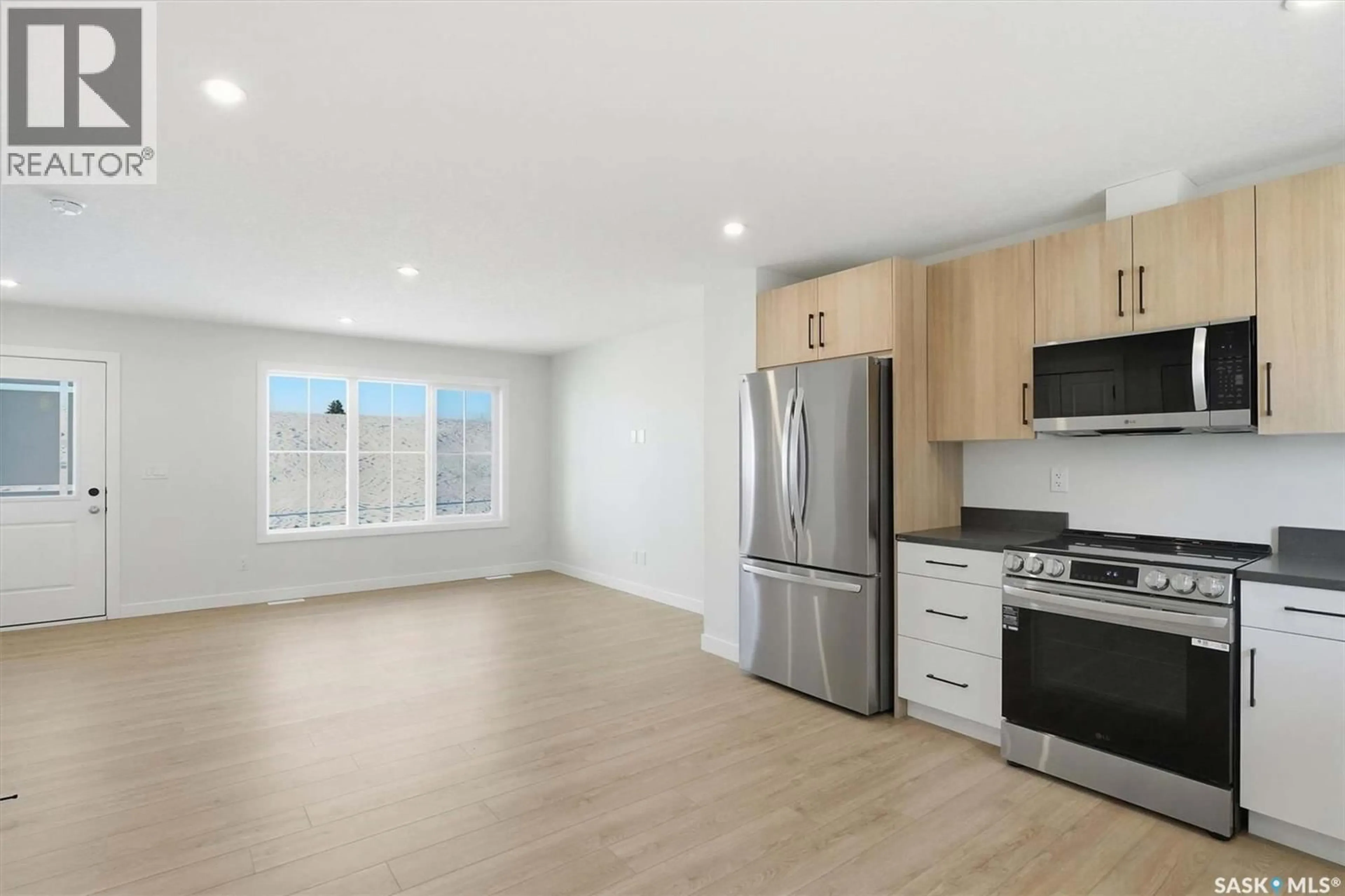 Open concept kitchen, wood/laminate floor for 6 101 MIROND ROAD, Martensville Saskatchewan S0K2T1