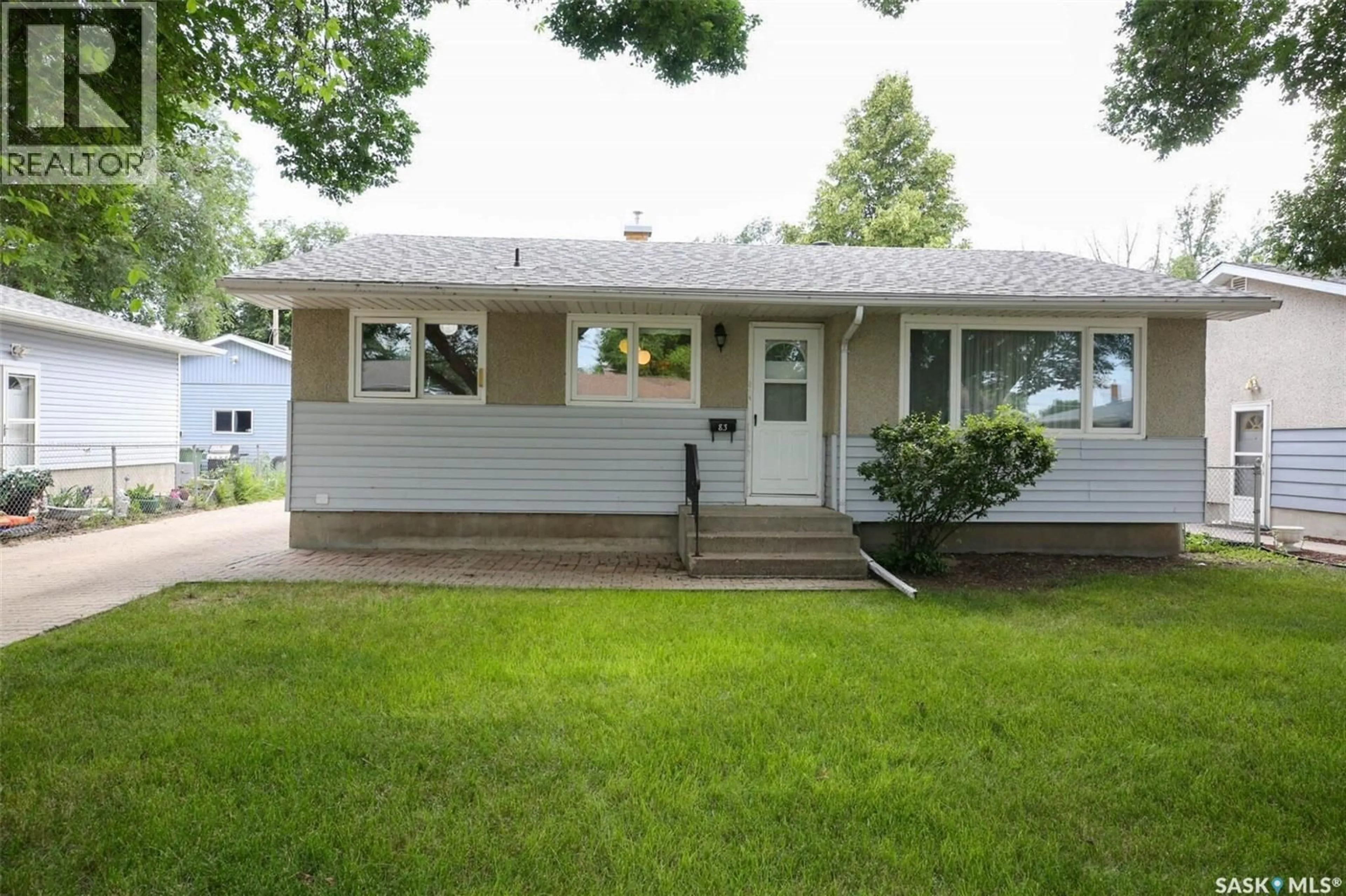 Home with vinyl exterior material, street for 83 WOODWARD AVENUE, Regina Saskatchewan S4R3H3
