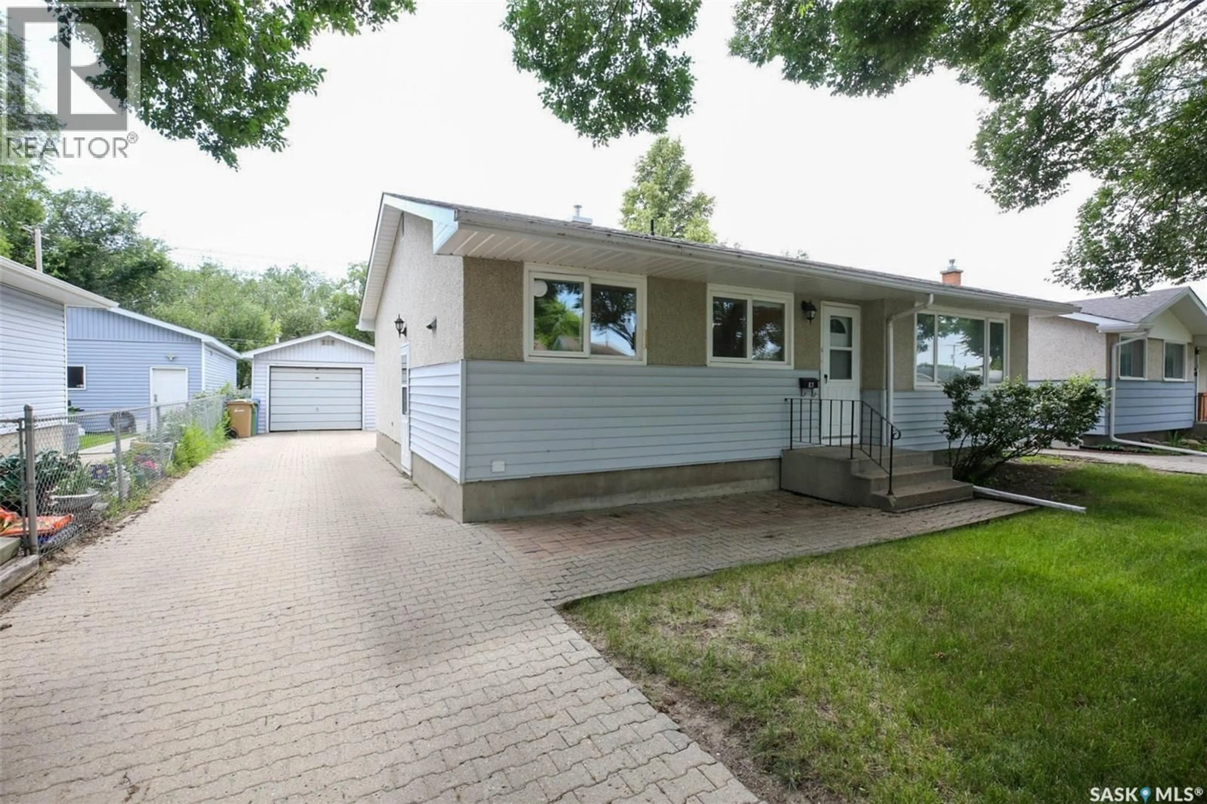 Home with vinyl exterior material, street for 83 WOODWARD AVENUE, Regina Saskatchewan S4R3H3