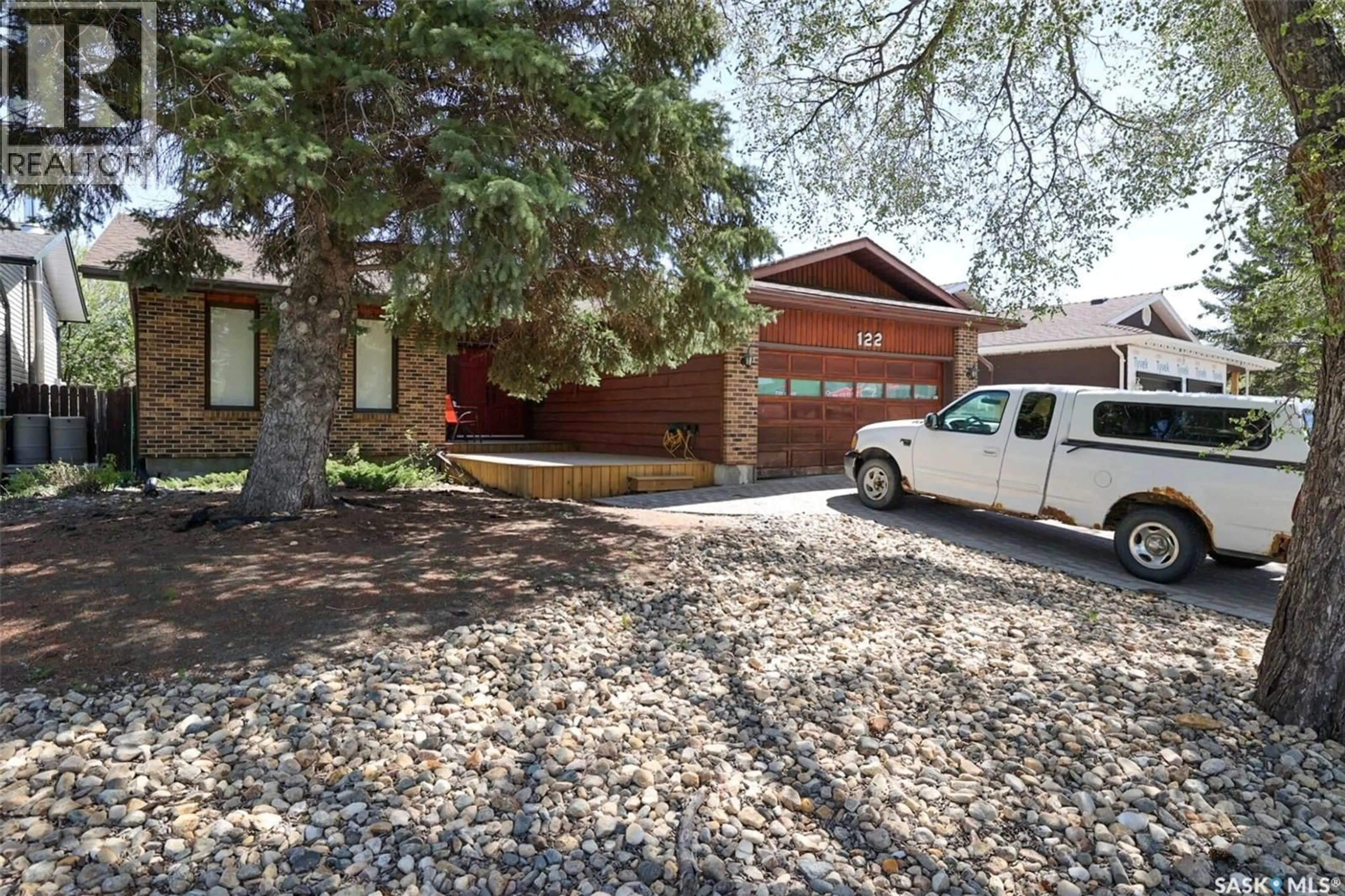 Home with brick exterior material, street for 122 EDENWOLD CRESCENT, Regina Saskatchewan S4R8A3