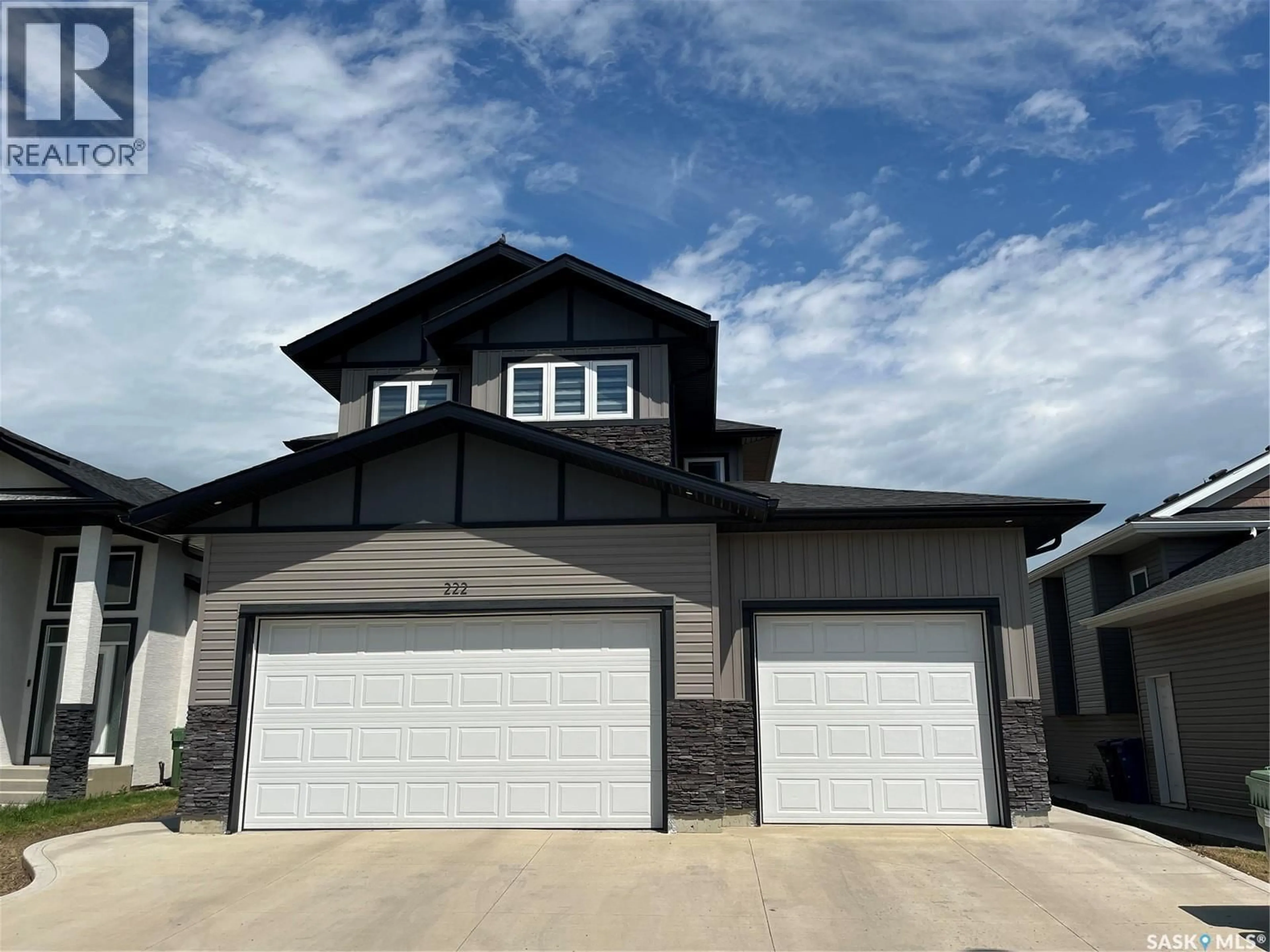 Home with vinyl exterior material, street for 222 NIGHTINGALE ROAD, Saskatoon Saskatchewan S7L6Y1