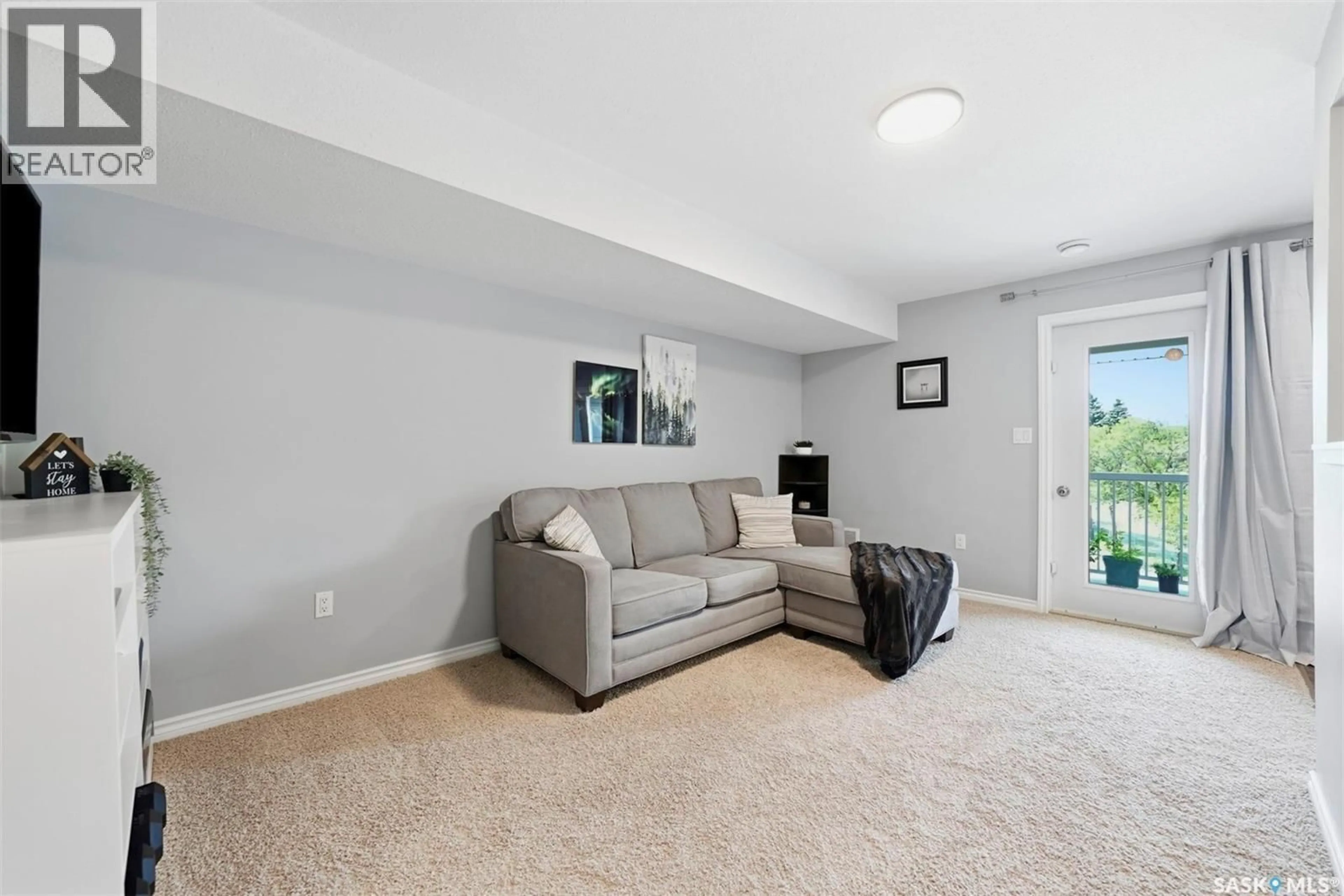 Living room with furniture, carpet floor for 203 - 515 28TH STREET, Prince Albert Saskatchewan S6V1X8