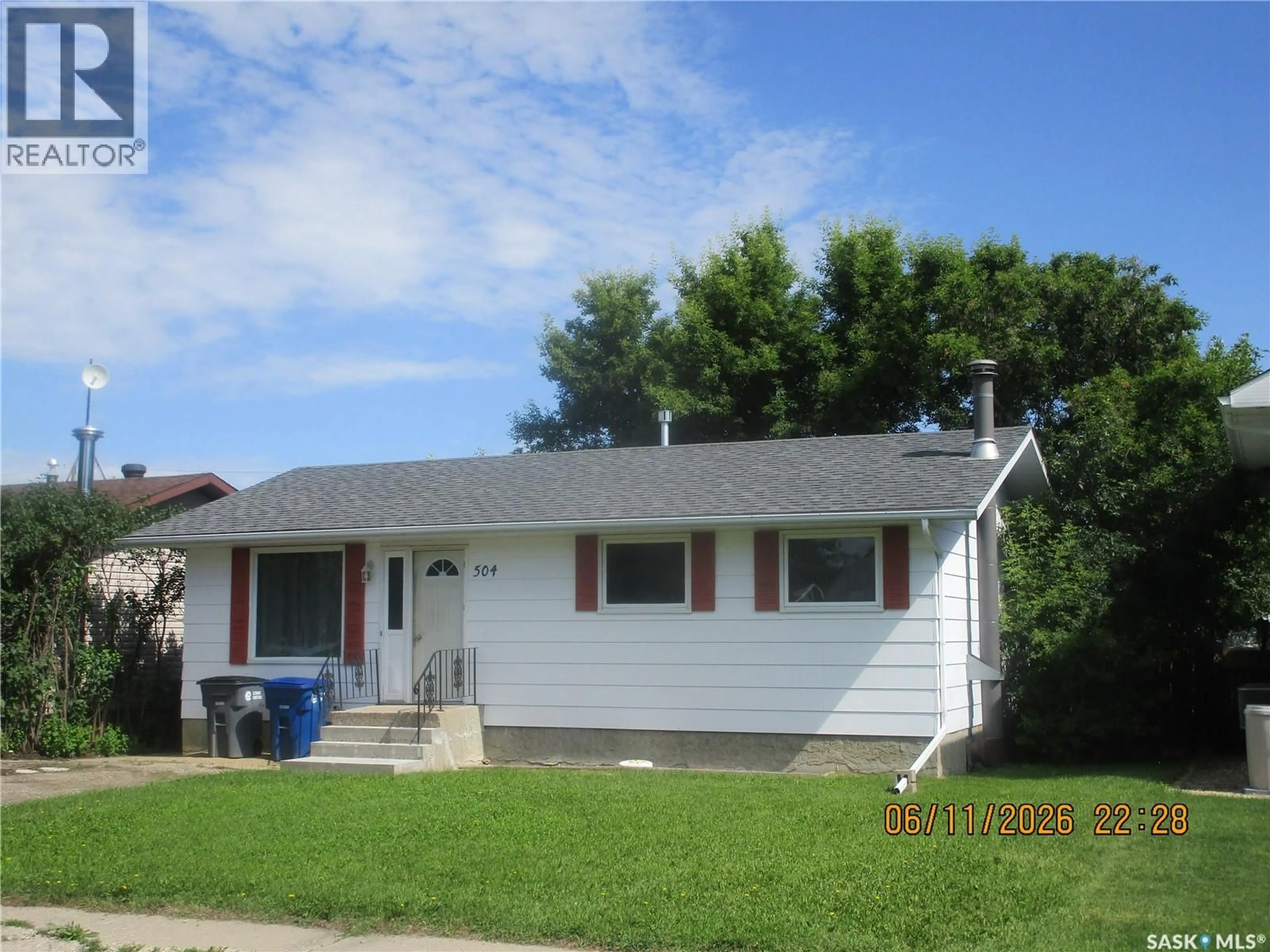 Home with vinyl exterior material, street for 504 4TH AVENUE, Assiniboia Saskatchewan S0H0B0