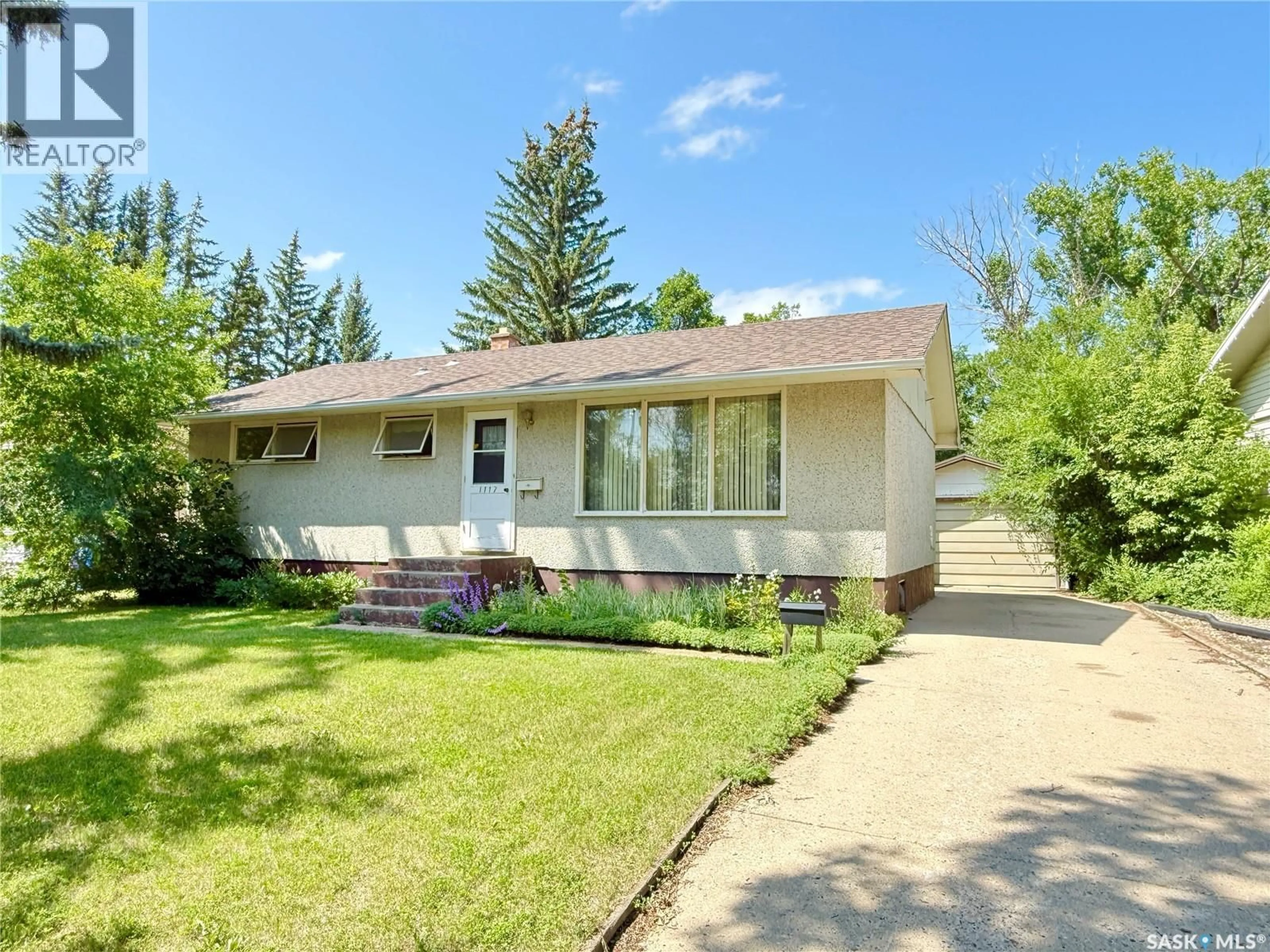 Home with vinyl exterior material, street for 1117 HARTNEY AVENUE, Weyburn Saskatchewan S4H0L9