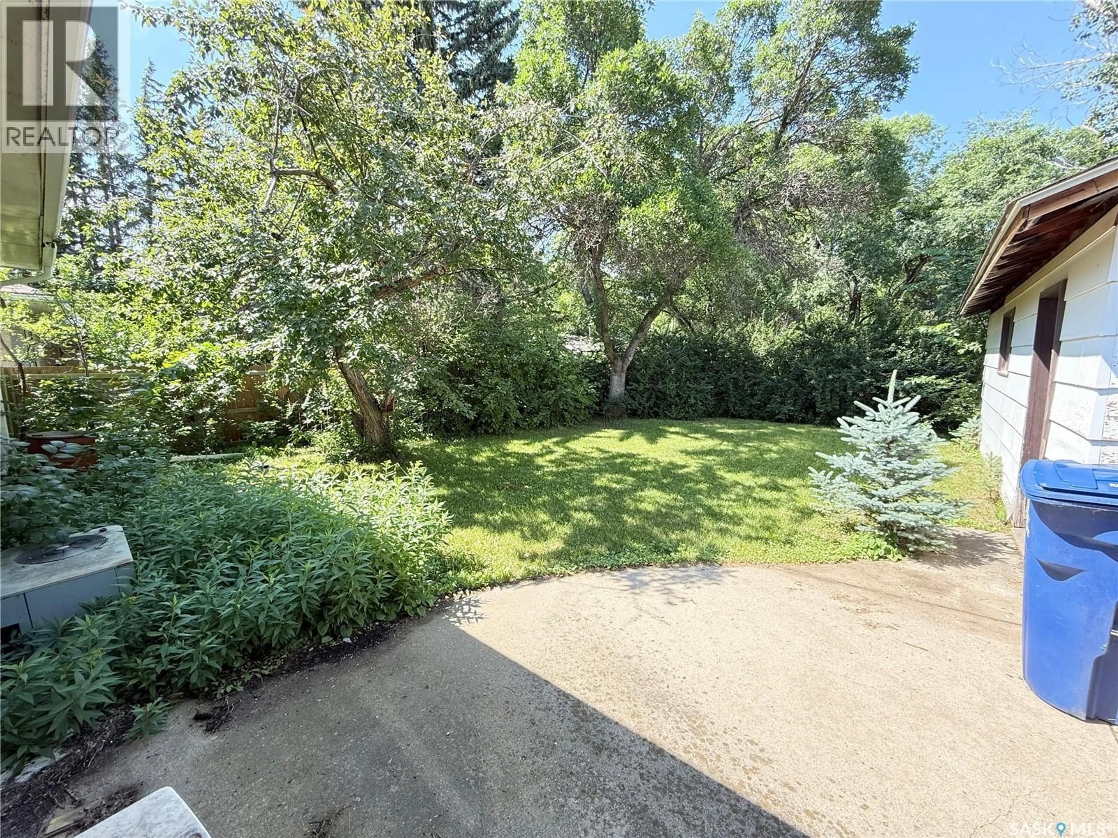 A pic from outside/outdoor area/front of a property/back of a property/a pic from drone, forest/trees view for 1117 HARTNEY AVENUE, Weyburn Saskatchewan S4H0L9
