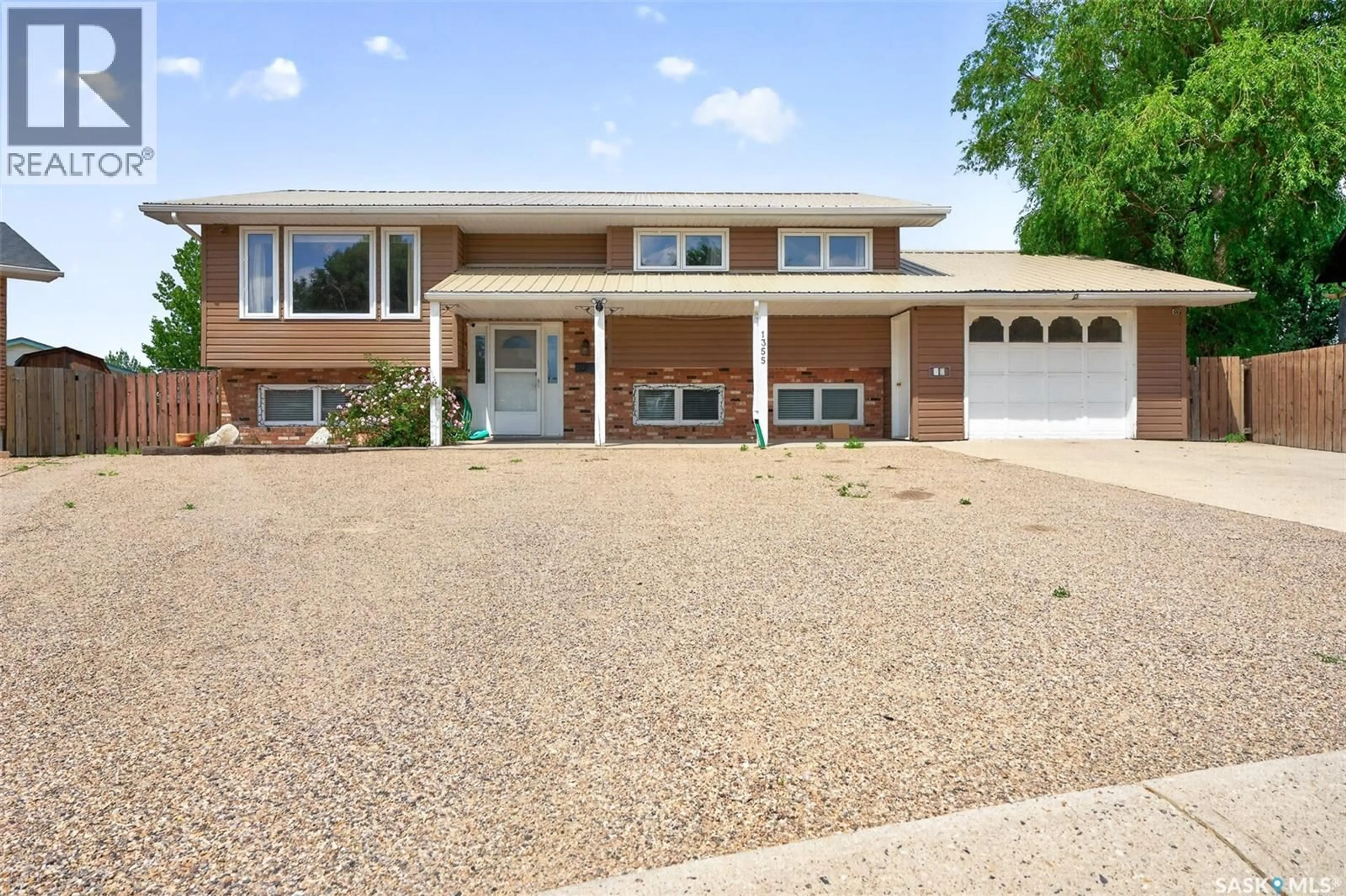 Home with vinyl exterior material, street for 1355 MANITOU CRESCENT, Moose Jaw Saskatchewan S6H7C4
