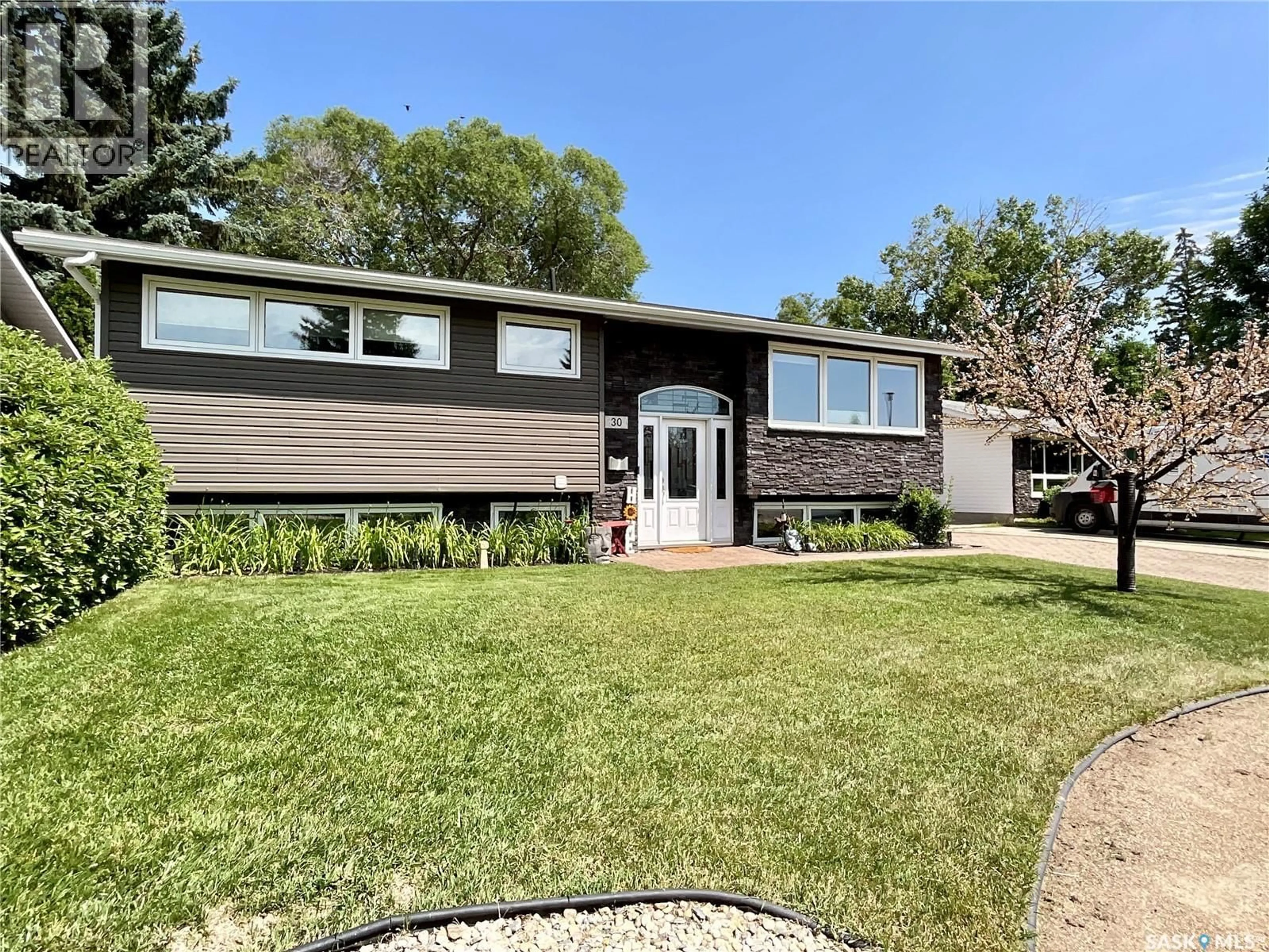 Home with vinyl exterior material, street for 30 ROSEWOOD PLACE, Regina Saskatchewan S4S5N5