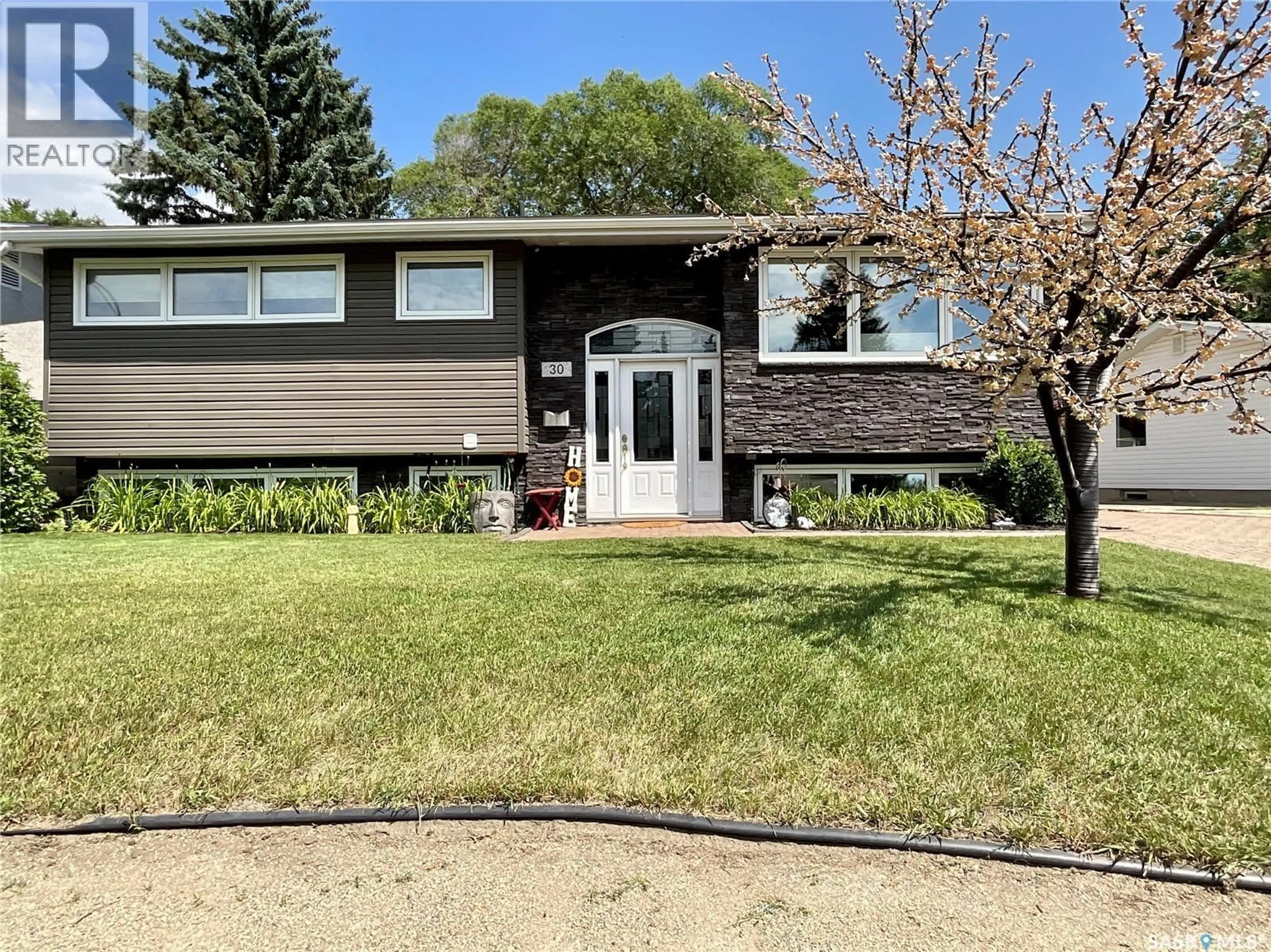 Home with vinyl exterior material, street for 30 ROSEWOOD PLACE, Regina Saskatchewan S4S5N5