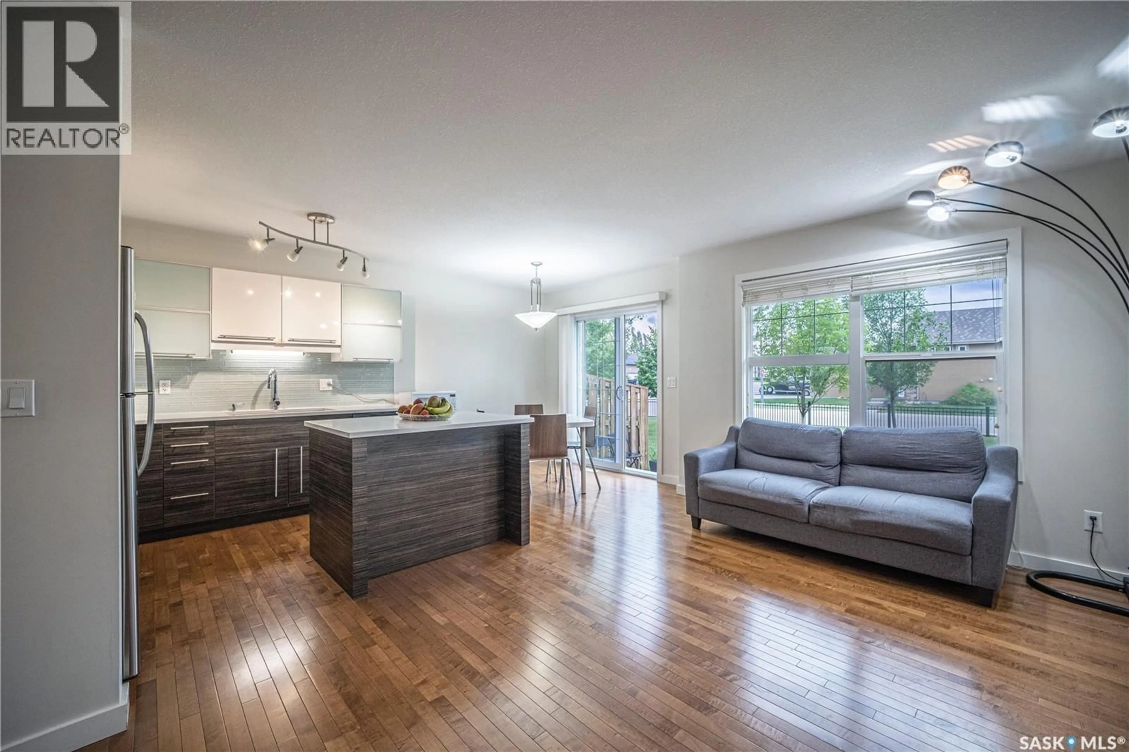 Open concept kitchen, wood/laminate floor for 307 - 710 GORDON ROAD, Saskatoon Saskatchewan S7T0J5