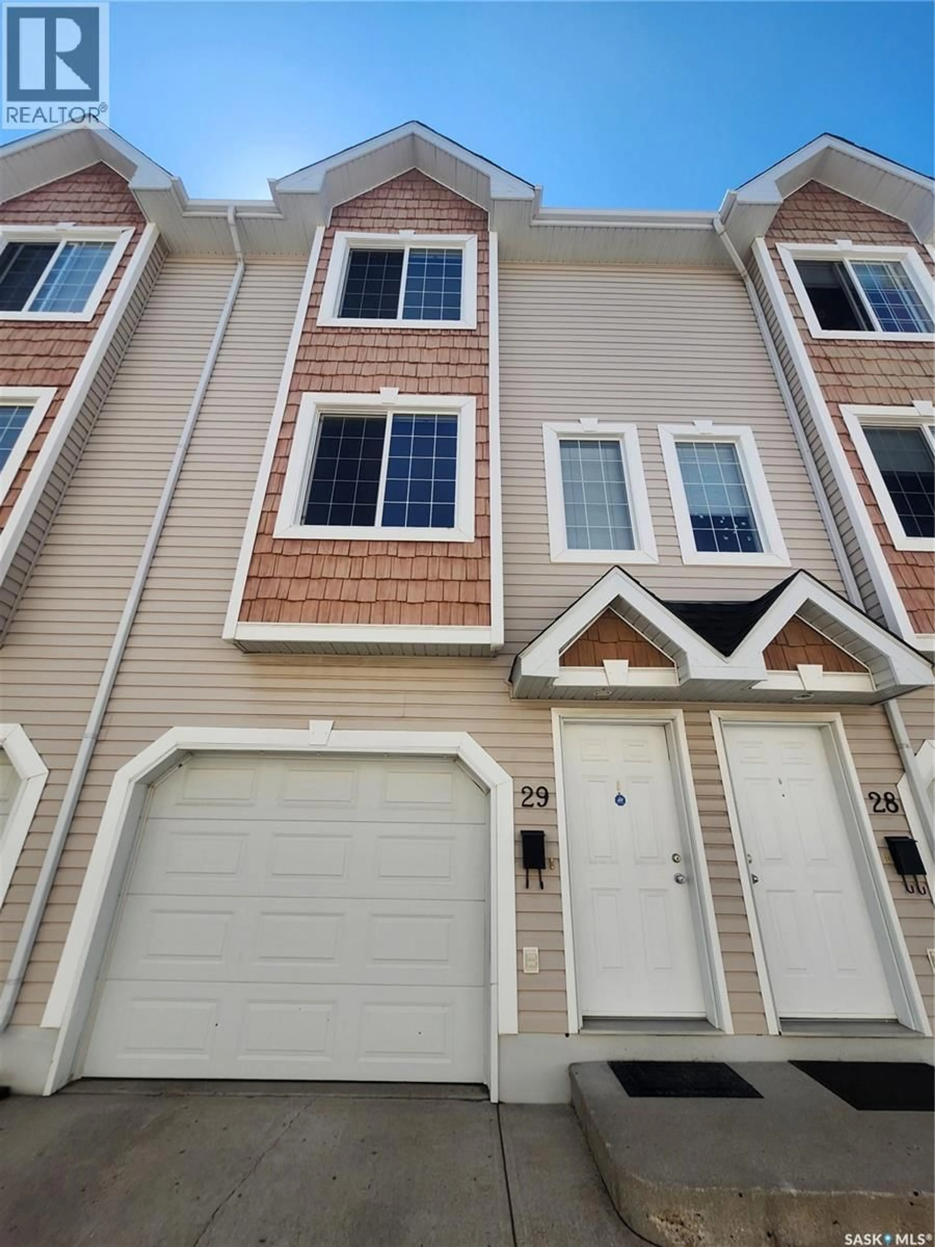 Home with vinyl exterior material, street for 29 243 HEROLD TERRACE, Saskatoon Saskatchewan S7T0K9