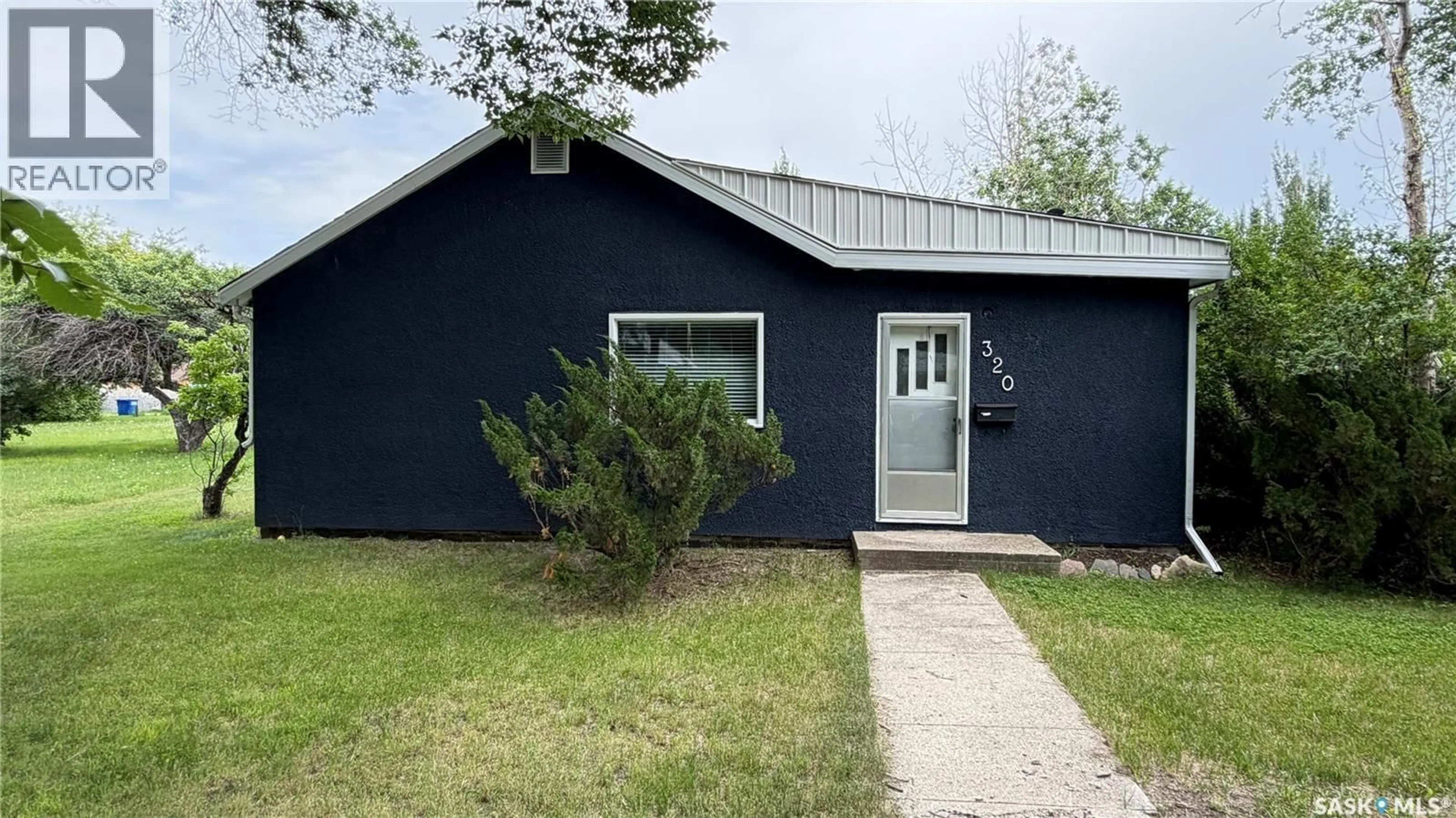 Home with vinyl exterior material, street for 320 ASPEN STREET, Maple Creek Saskatchewan S0N1N0