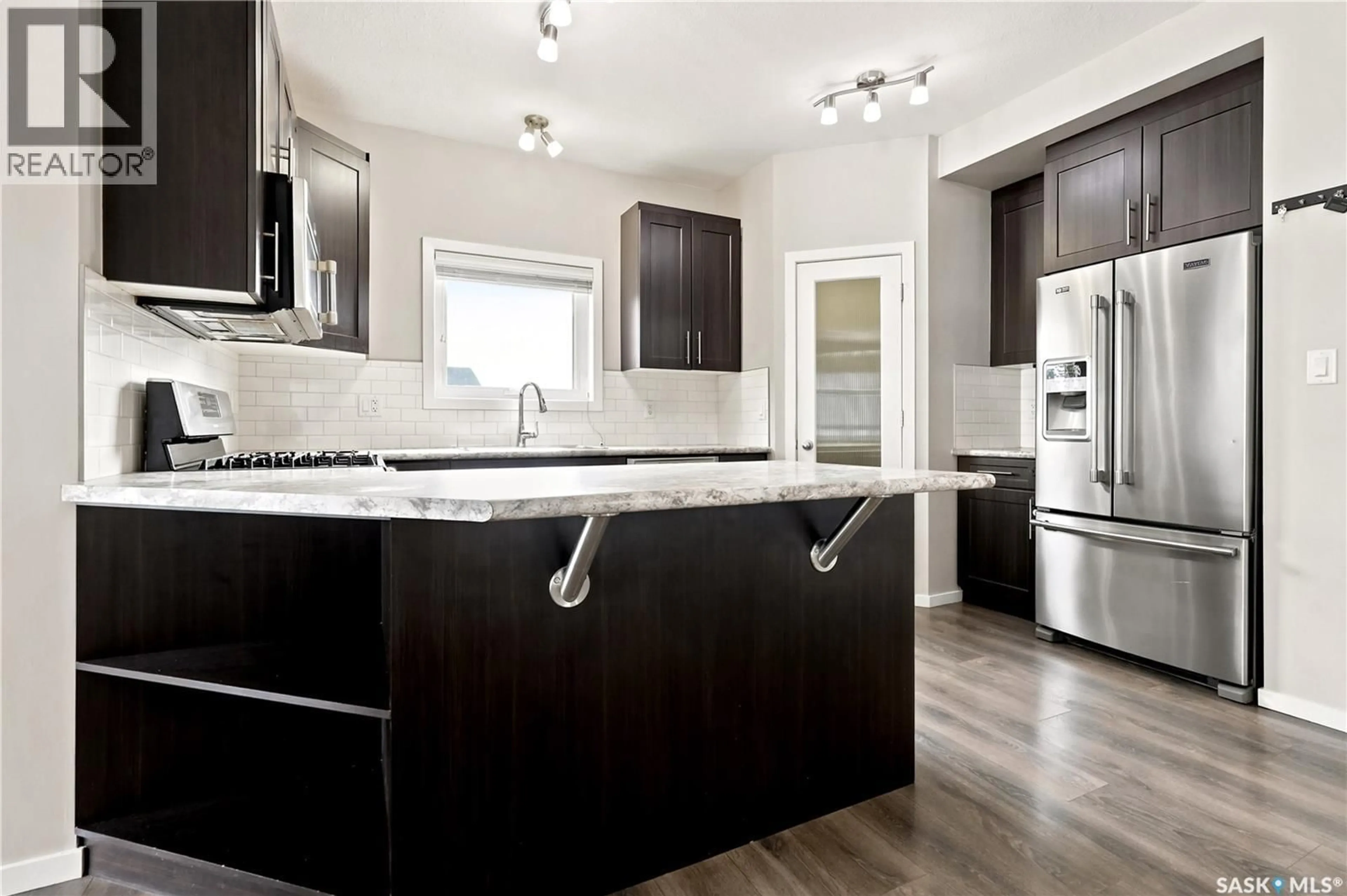 Contemporary kitchen, wood/laminate floor for 2802 RIDGWAY AVENUE, Regina Saskatchewan S4X0N1