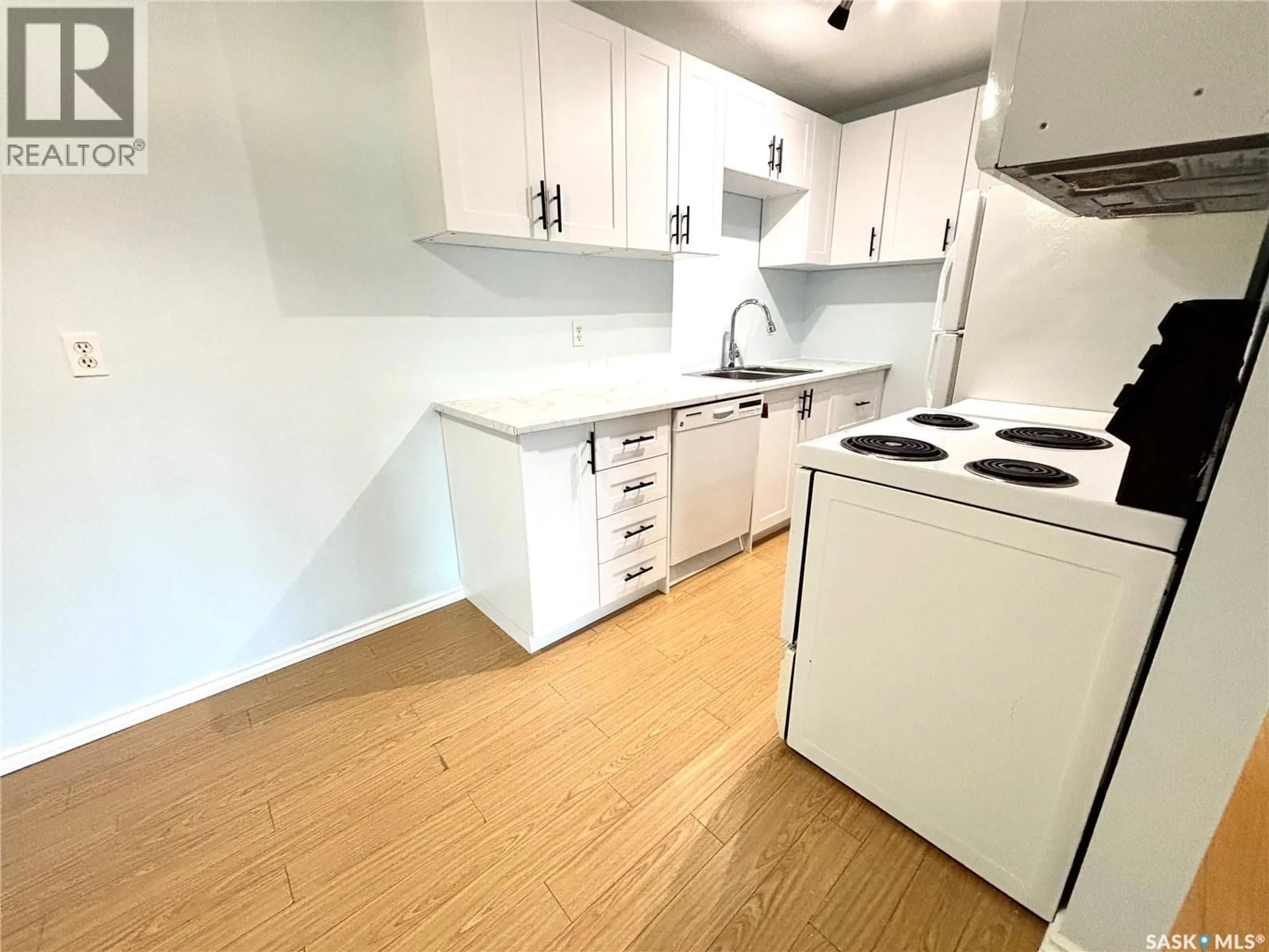 Standard kitchen, wood/laminate floor for 104 307 TAIT CRESCENT, Saskatoon Saskatchewan S7H5L6