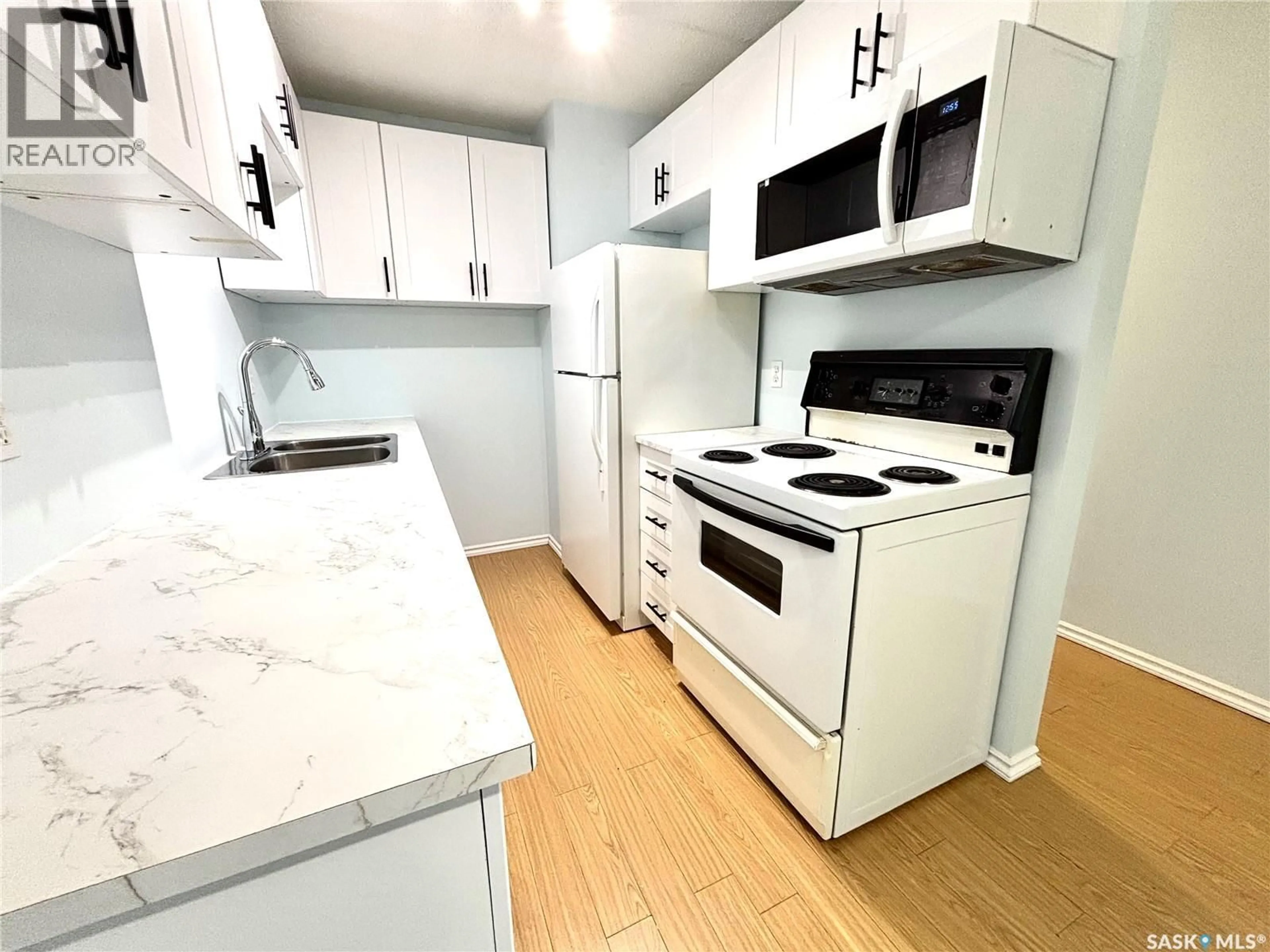 Standard kitchen, wood/laminate floor for 104 307 TAIT CRESCENT, Saskatoon Saskatchewan S7H5L6