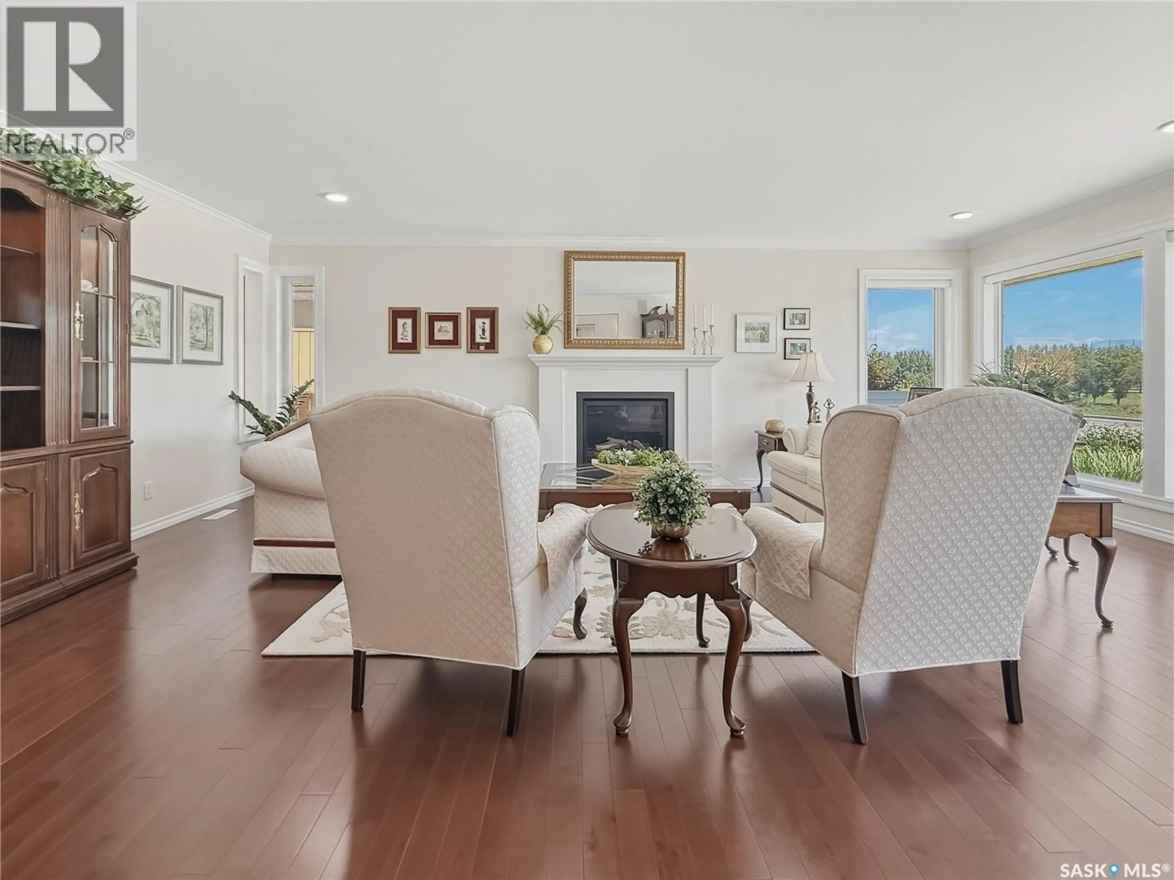 Living room with furniture, wood/laminate floor for 1165 NORTH HILL DRIVE, Swift Current Saskatchewan S9H1X8