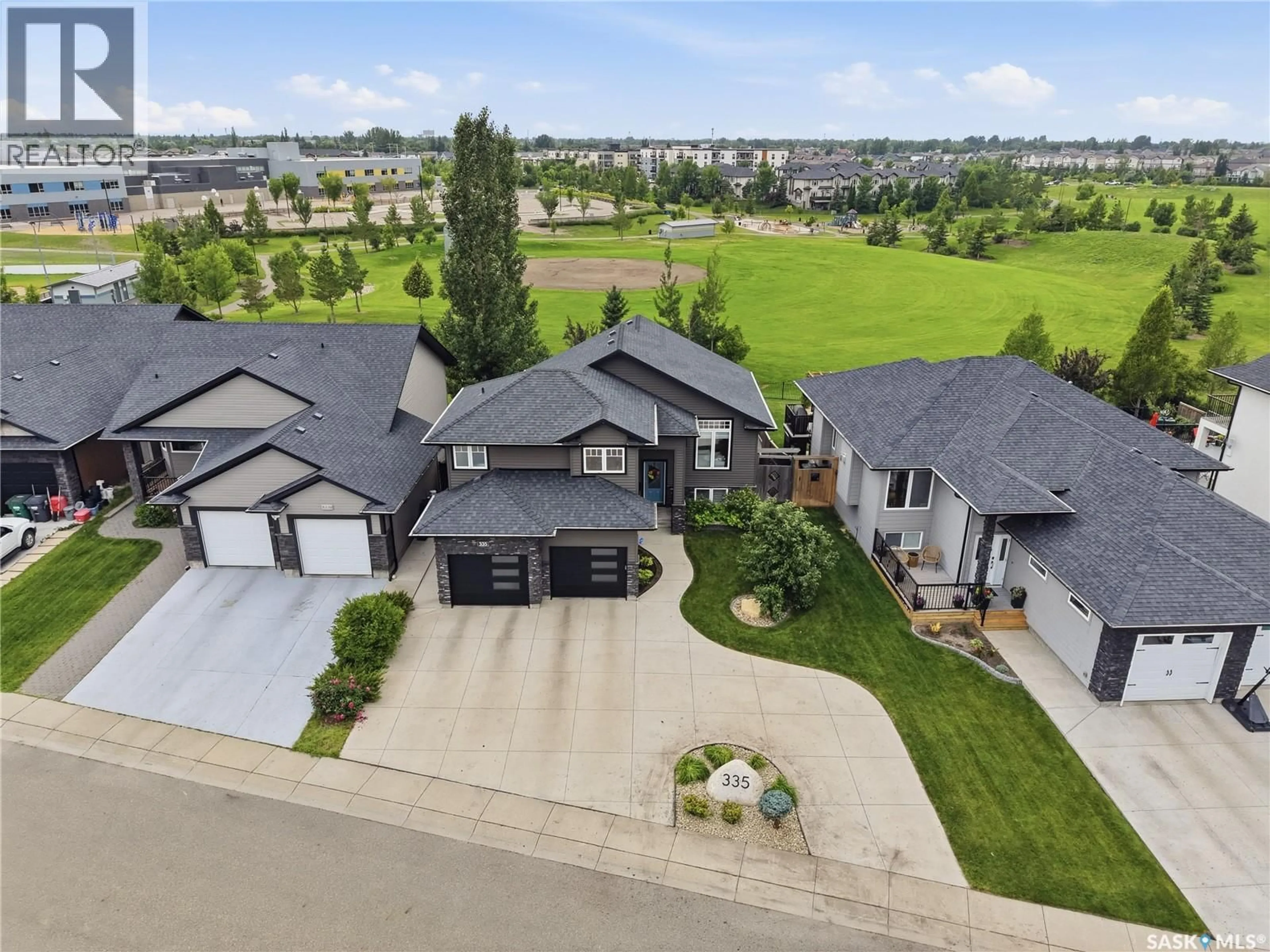 A pic from outside/outdoor area/front of a property/back of a property/a pic from drone, mountain view for 335 DAWSON CRESCENT, Saskatoon Saskatchewan S7R0K1